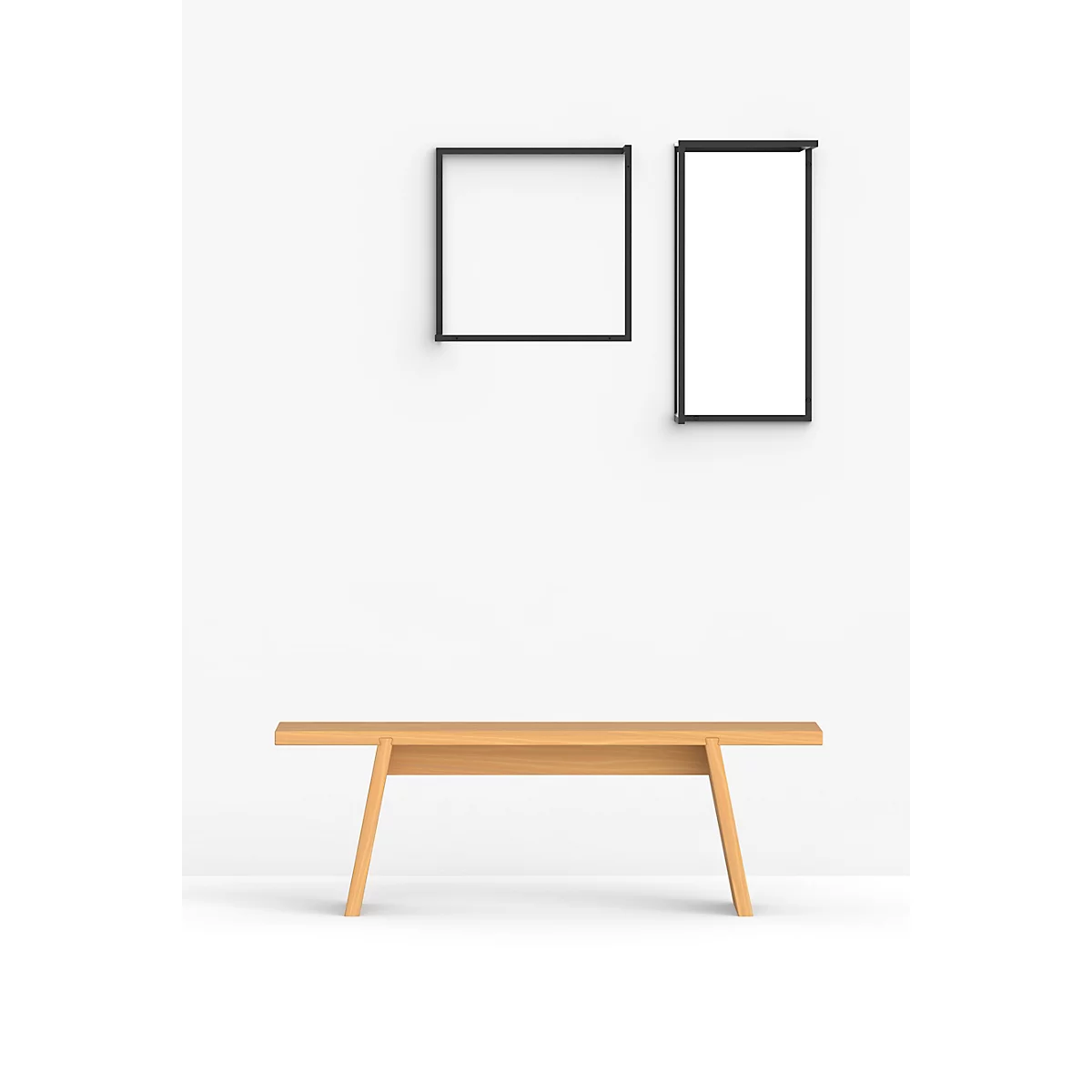 Banc en bois devant un mur blanc avec des cadres noirs.