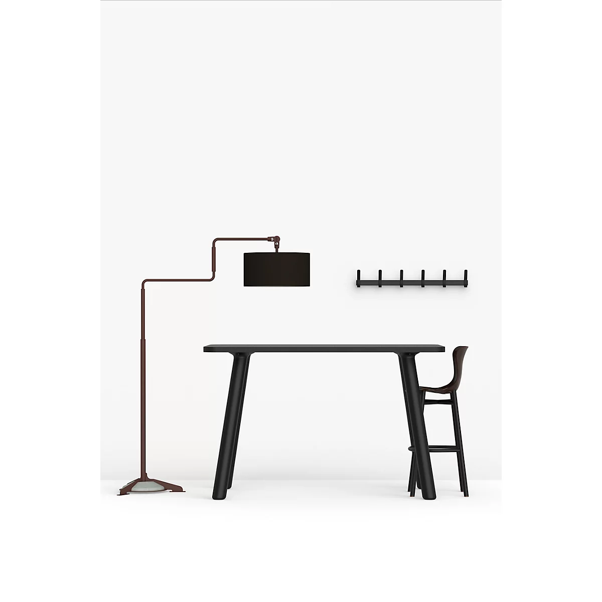 Table haute noire avec chaise, lampe et crochets muraux sur fond blanc.