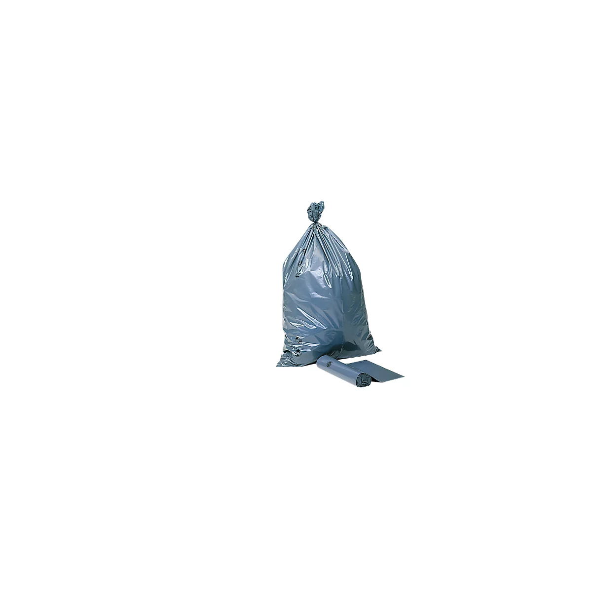 Gray garbage bag tied in a knot, next to it a roll and a sheet of garbage bags.