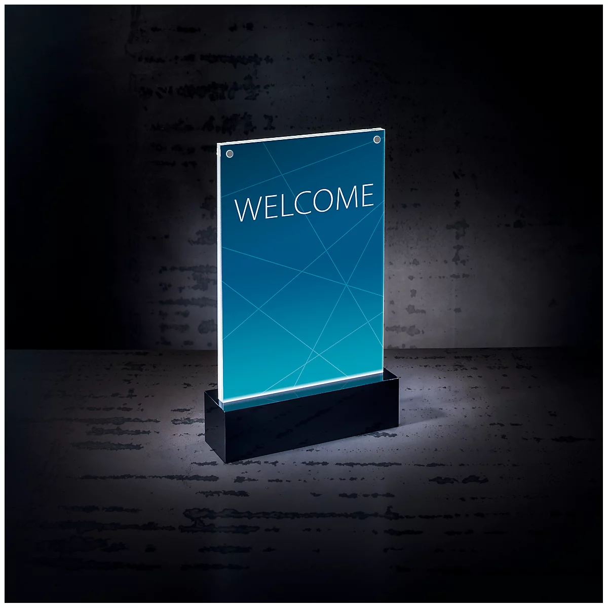 An illuminated sign displaying the word "WELCOME" on a blue backdrop. It is standing on a black base against a dark background.
