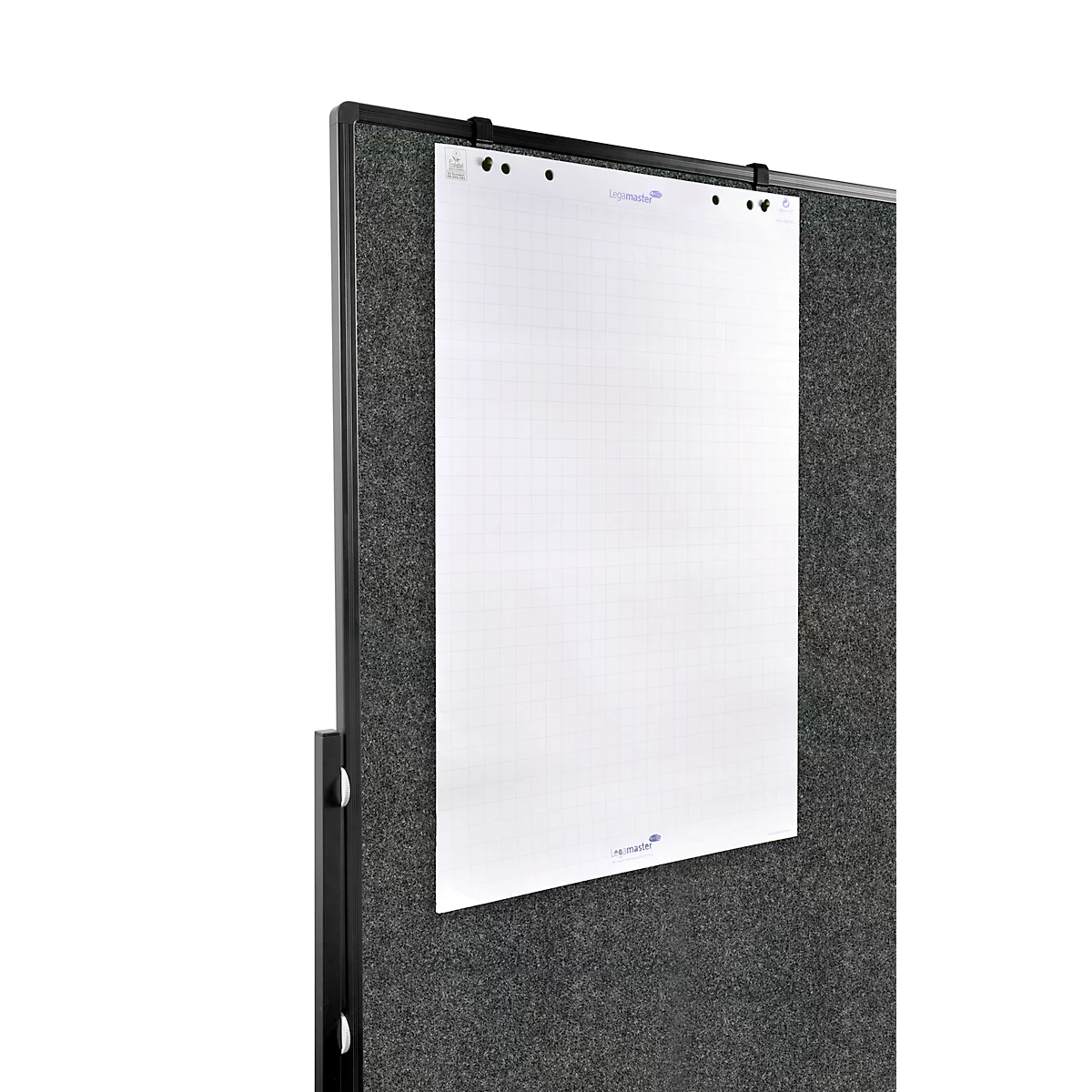 White paper on dark wall. Black frame. Blue details visible on the paper.