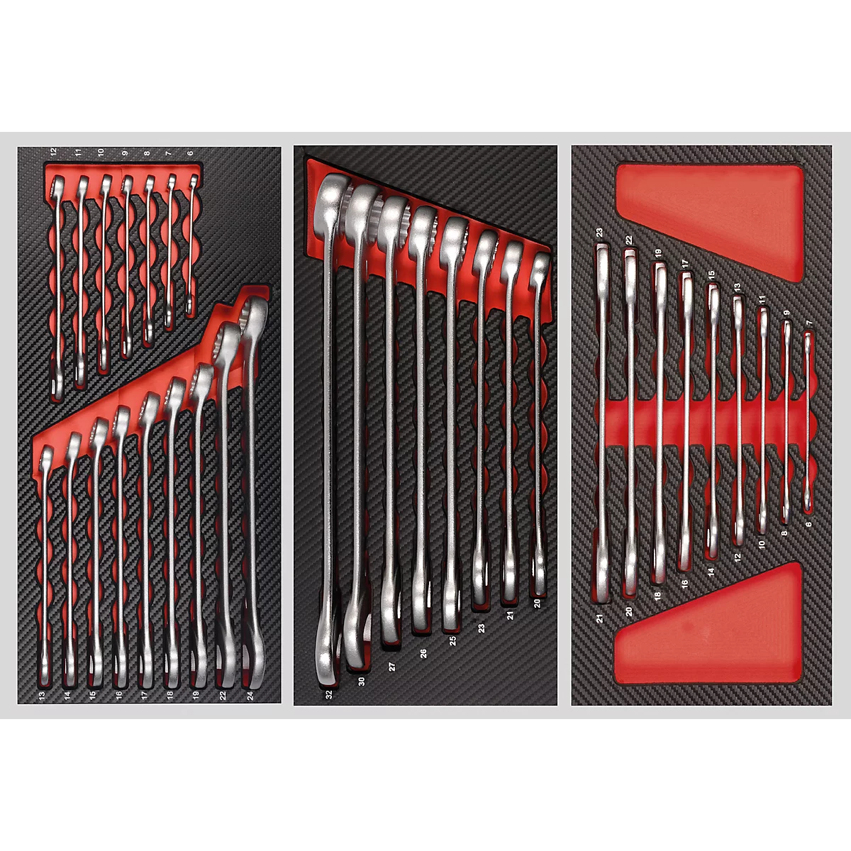 Tool case with various wrenches arranged in red holders on a dark, textured background.