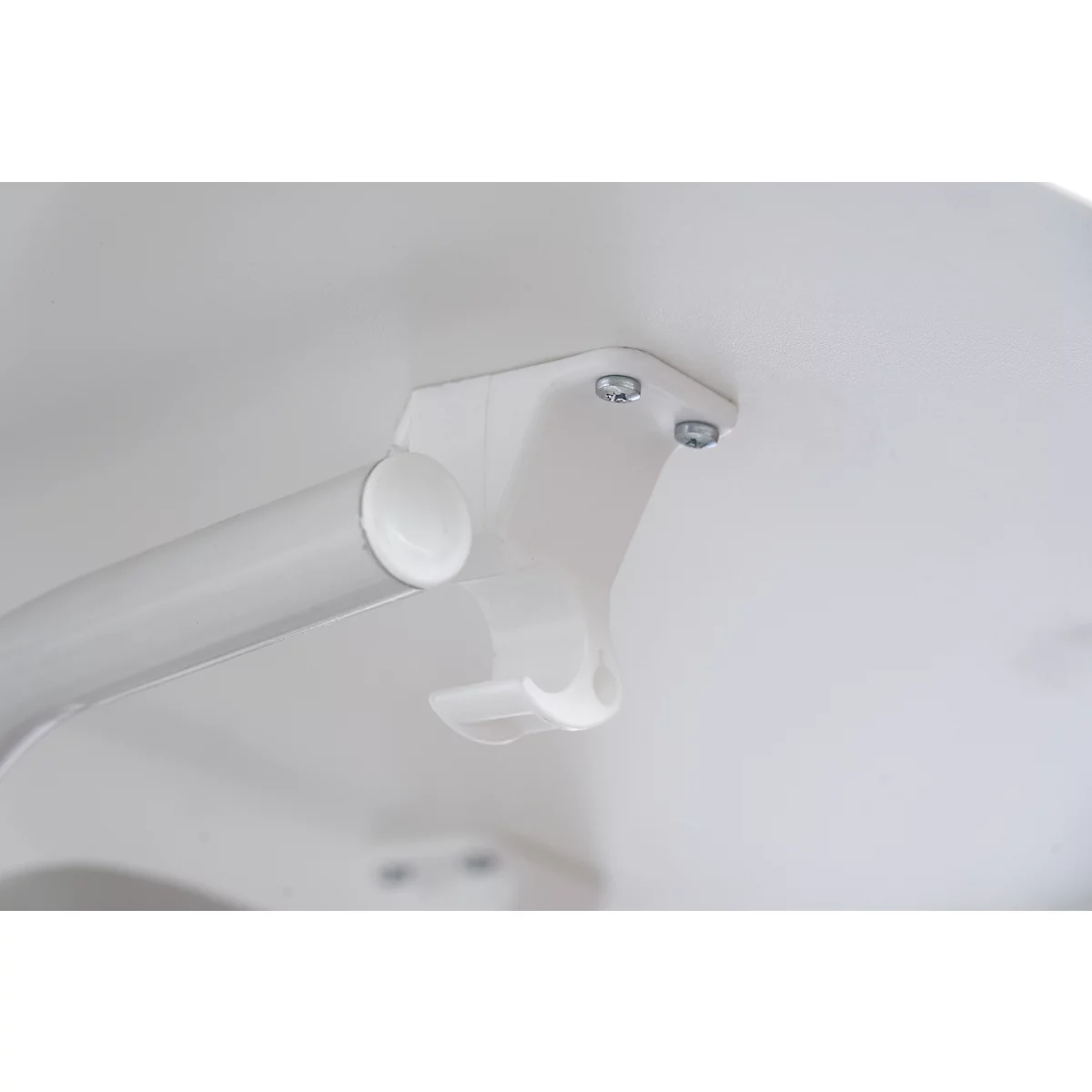 Detail view: White table leg detail with screws and bracket.