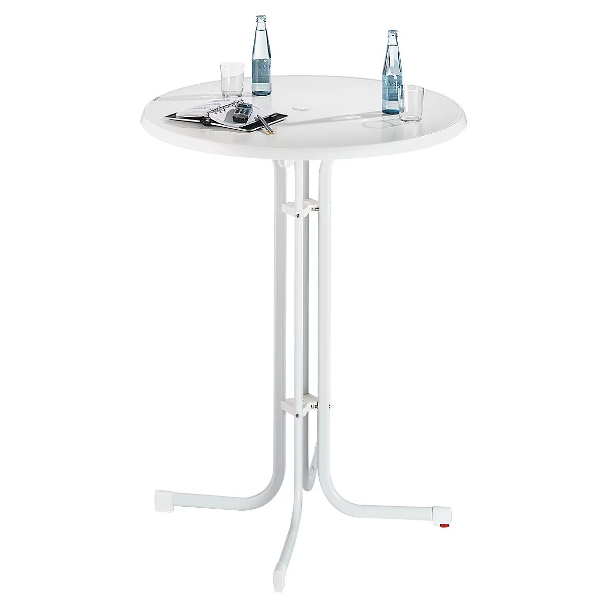 White standing table with round tabletop. On it, two bottles, glasses and papers.