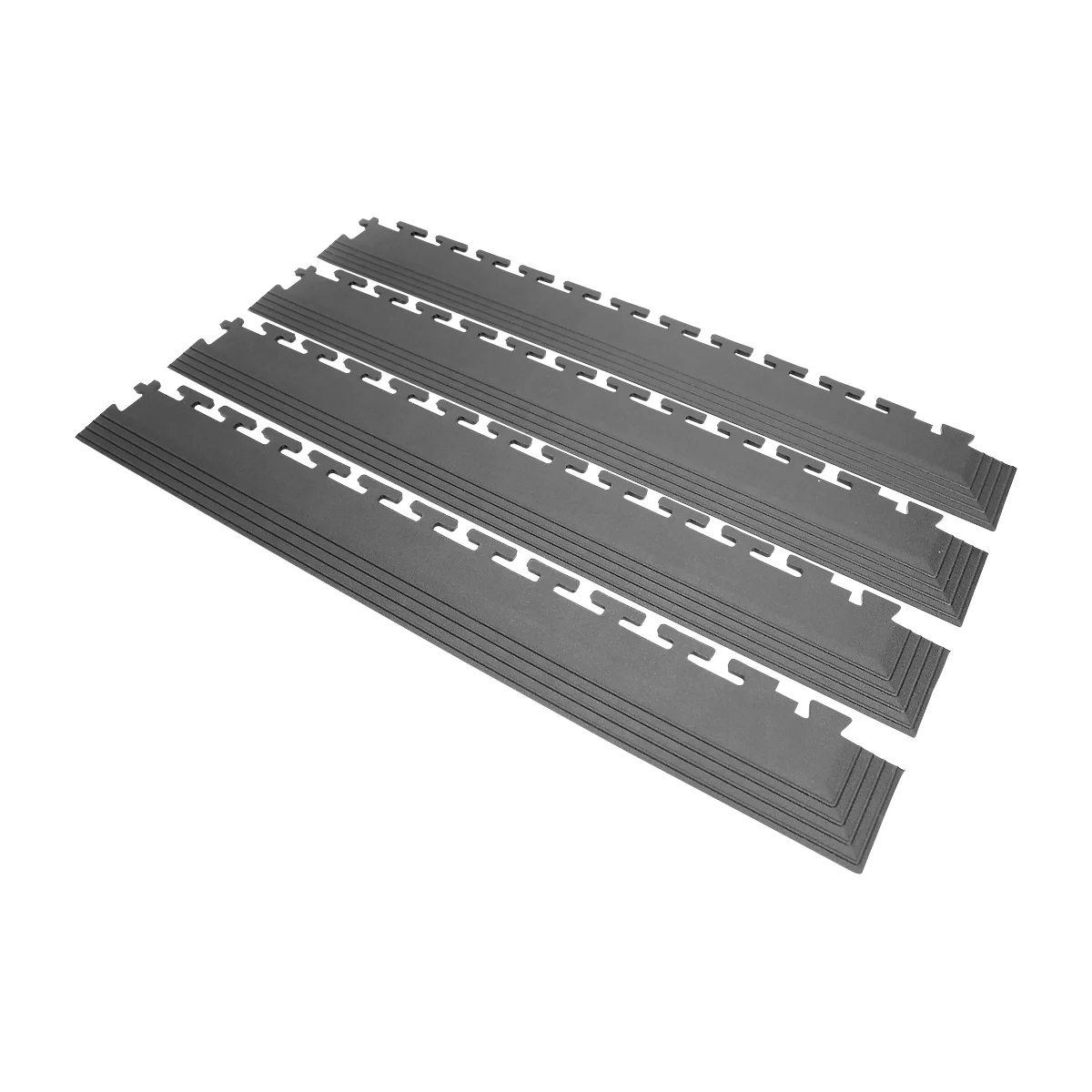 Graue, ineinandergreifende Bodenplatten liegen auf weißem Hintergrund. Die Platten haben eine geriffelte Oberfläche.
