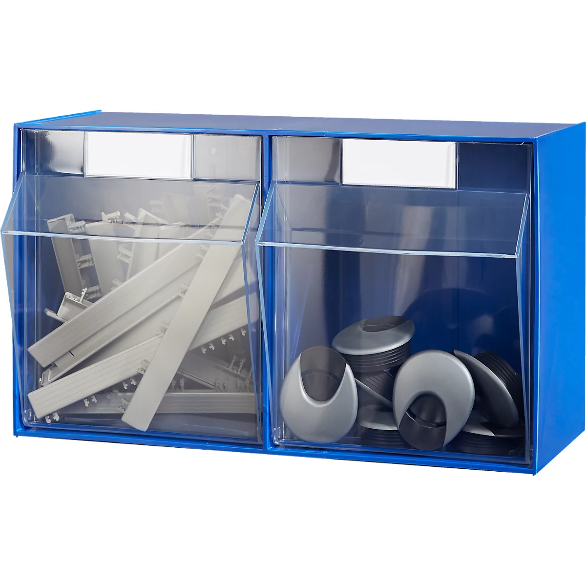 Conteneur bleu à deux compartiments remplis de pièces grises et noires. Façades en plastique transparent.