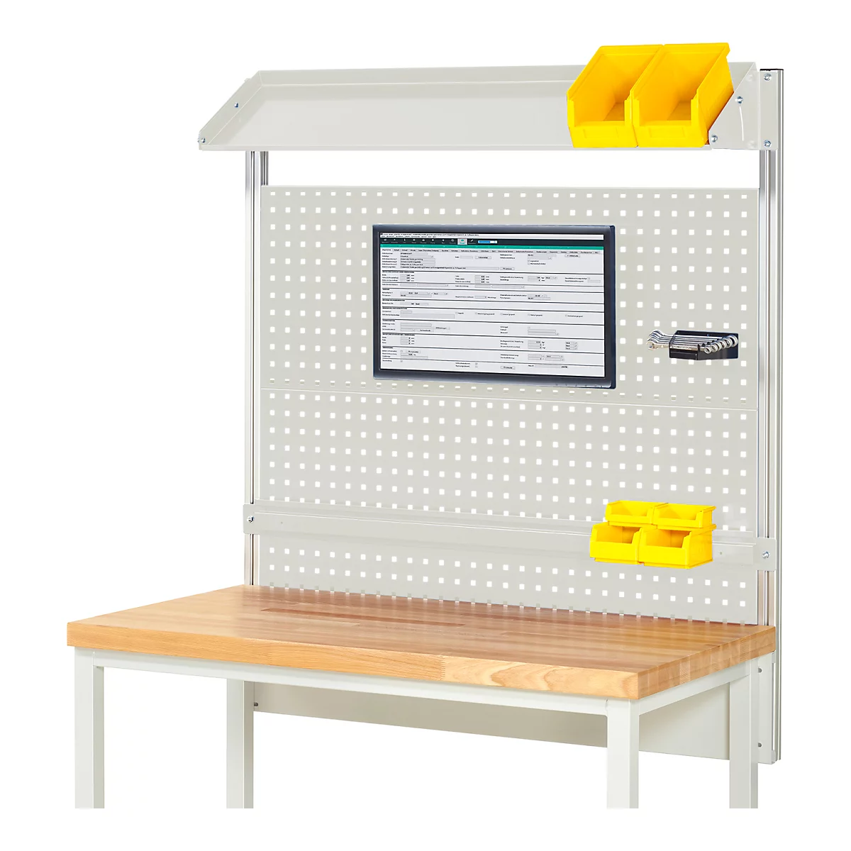 Werkbank met gaatjesbord, planken, documenten, gele bakken. Houten tafelblad, wit metalen frame. Werkplaatsomgeving.