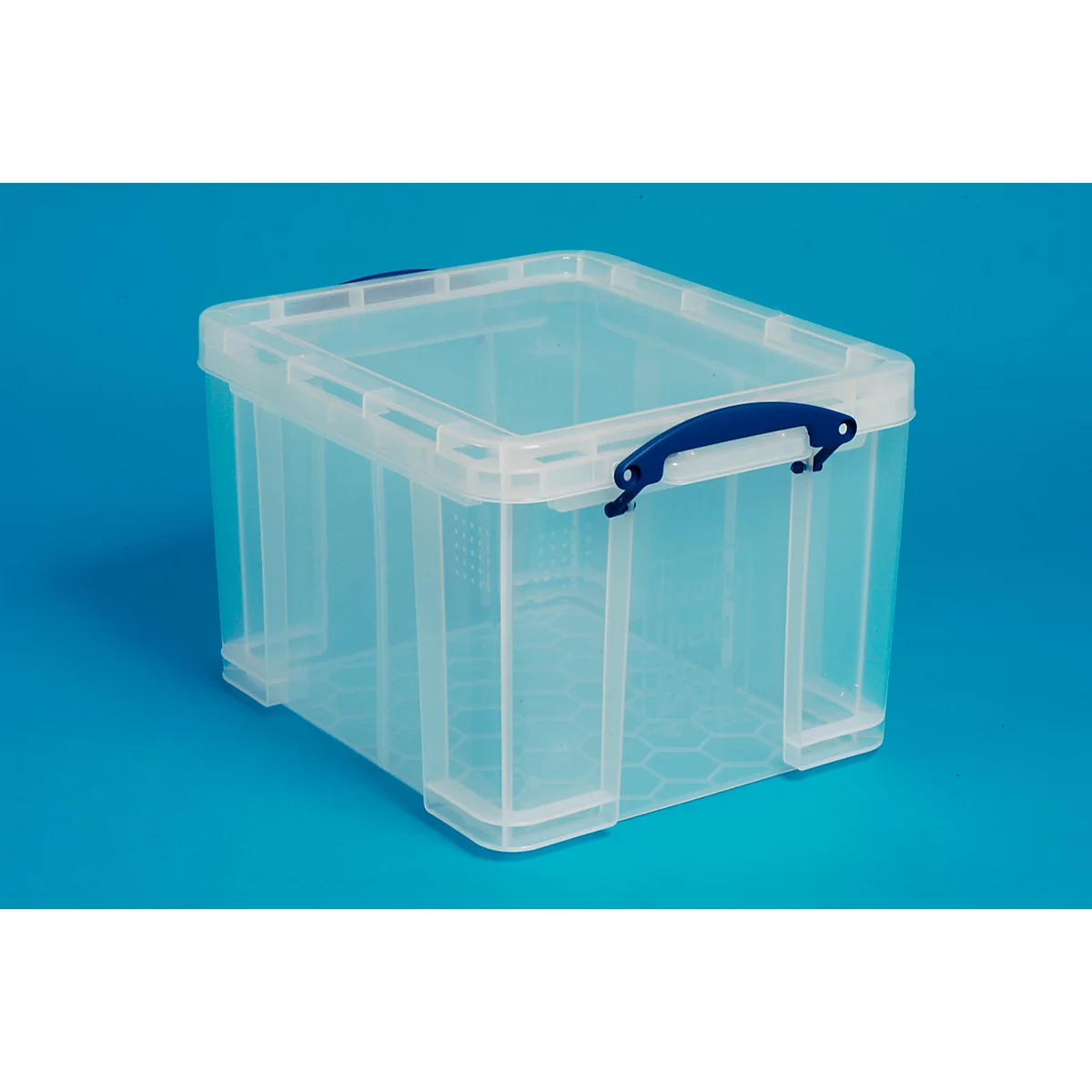 Transparent plastic box with blue handle on blue background.