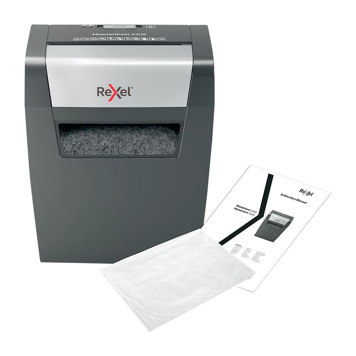 Shredder with shredded paper, next to an instruction manual and a bag.