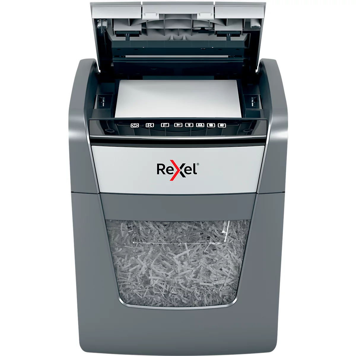 Grey paper shredder with paper ejection, Rexel logo, paper being shredded.