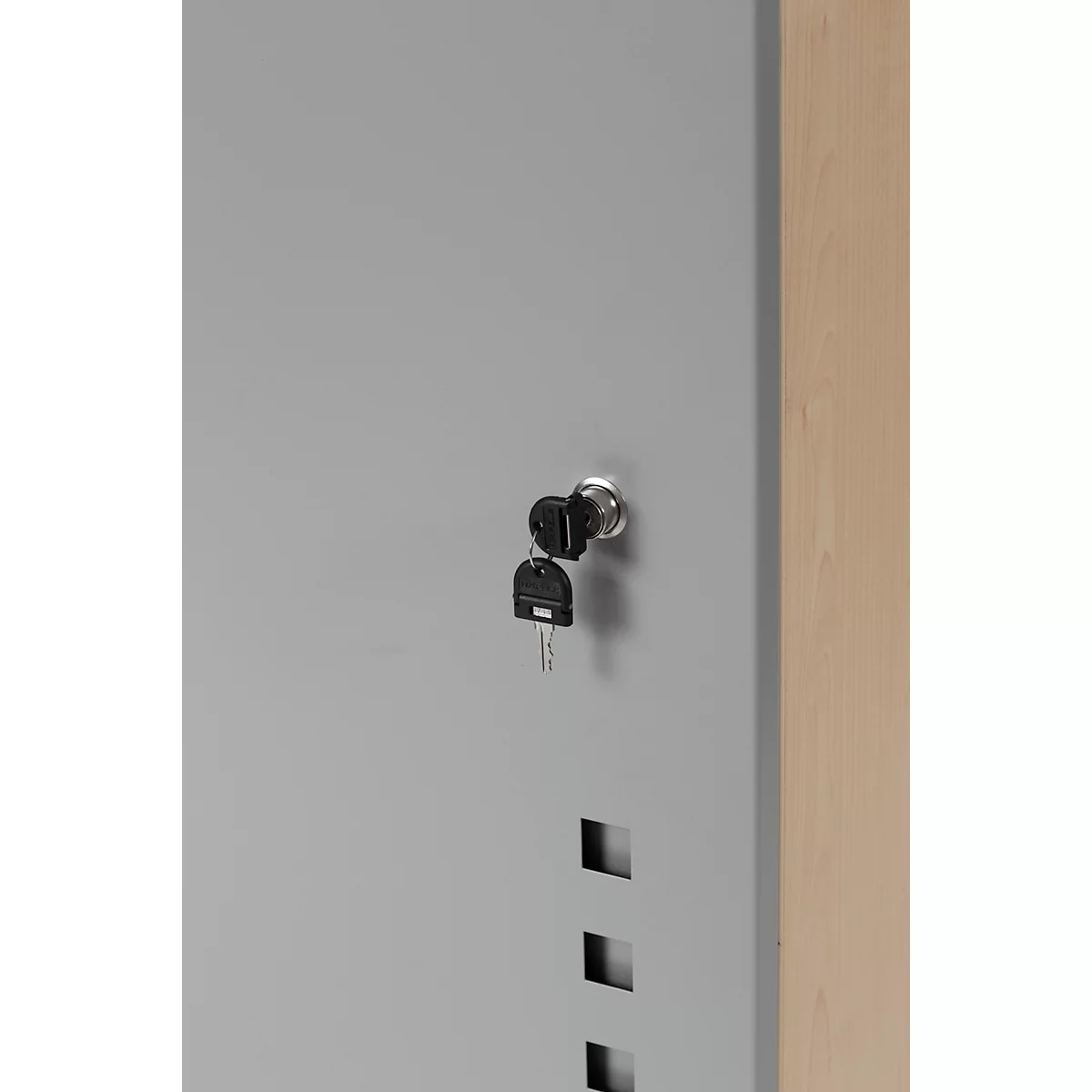 Grey cabinet, keys in the lock, other keys hanging next to it.