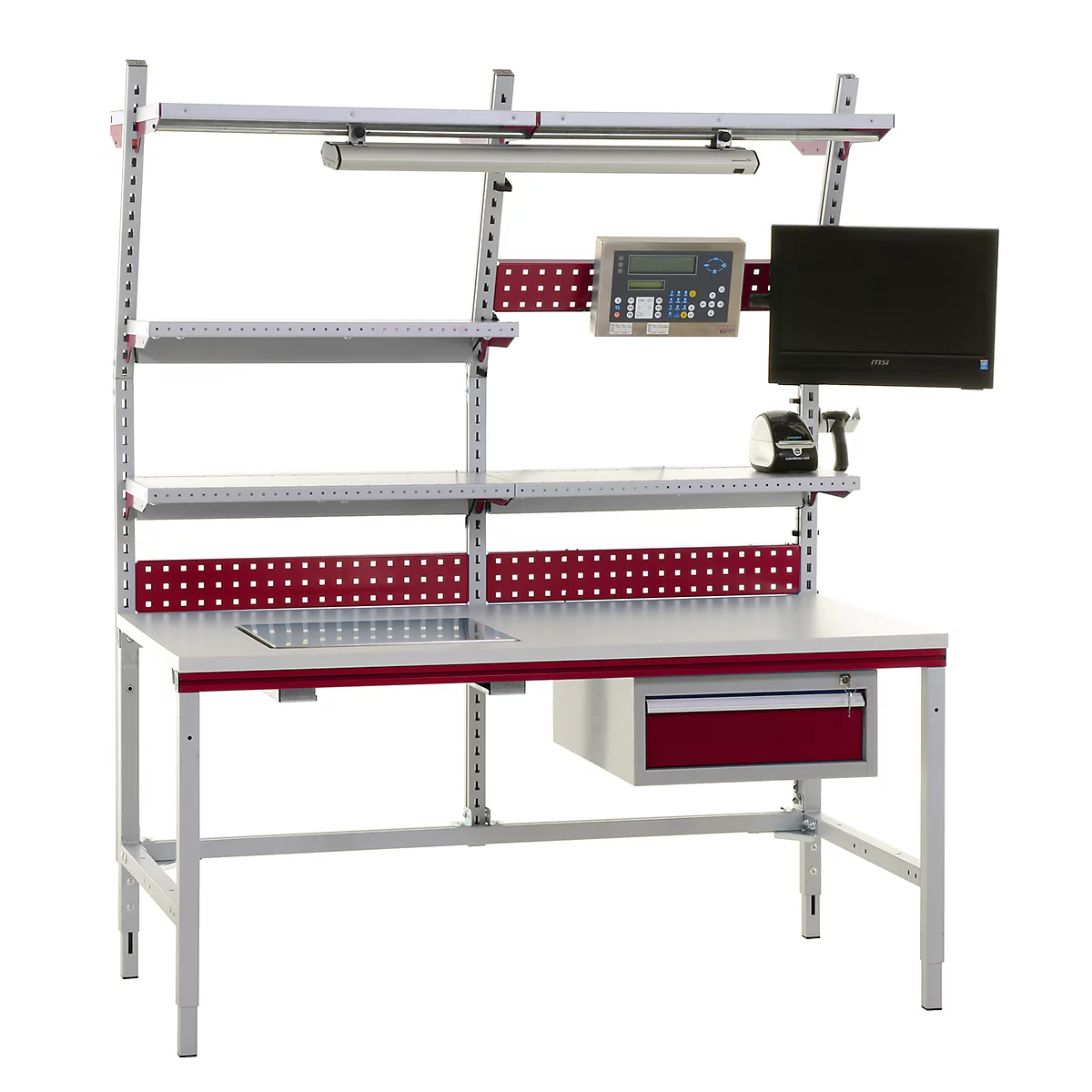 A gray workbench workstation with red accents and an array of equipment, including a monitor.