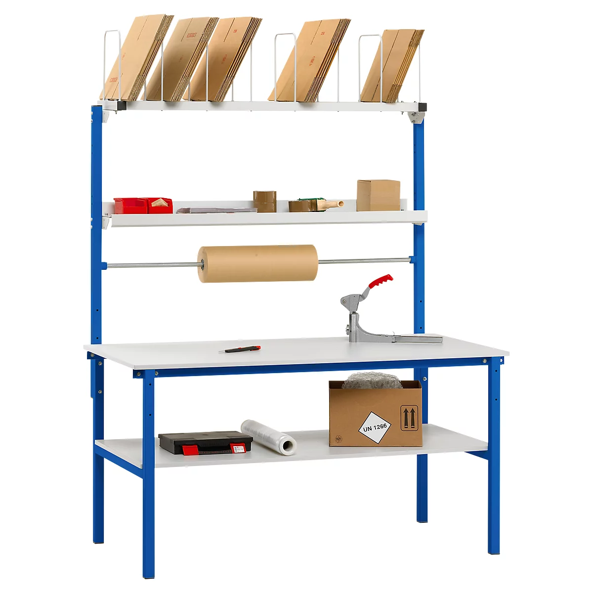 Packing table with blue frame, wooden boards, cardboard and tools. Top level with boards, rolls and tools. A paper roll at the middle level.