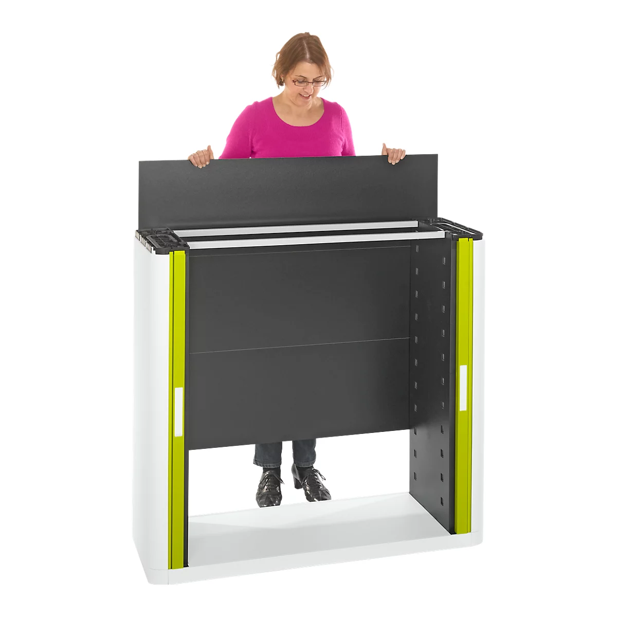 A woman behind a white, black, and green presentation lectern. She is holding the top of the lectern.