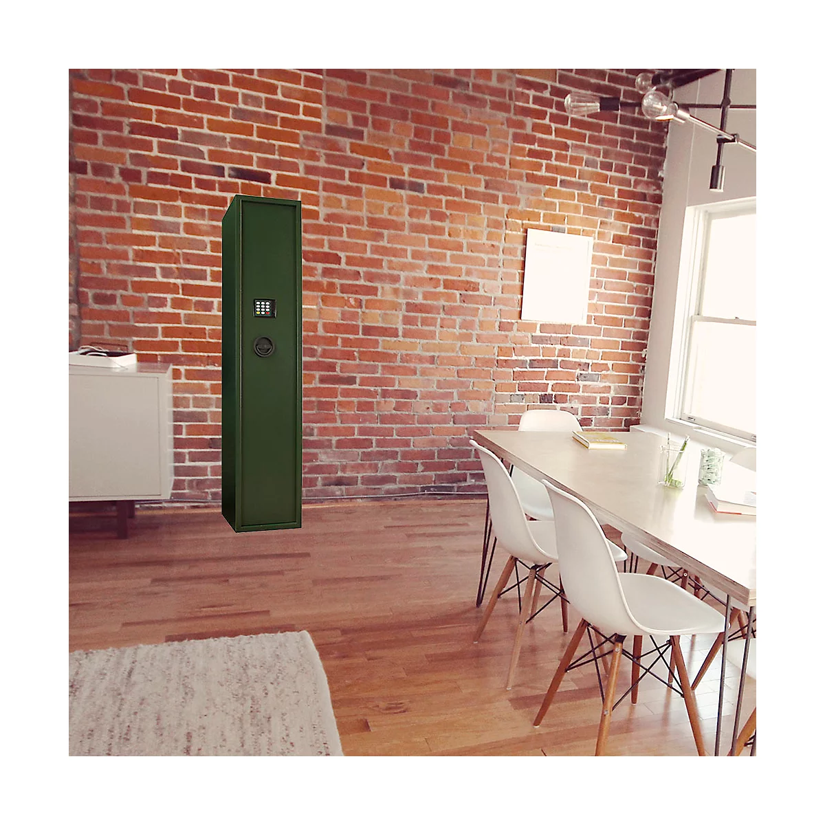 Green tall gun safe in a room with brick wall and wooden floor. A dining table with white chairs stands next to it.
