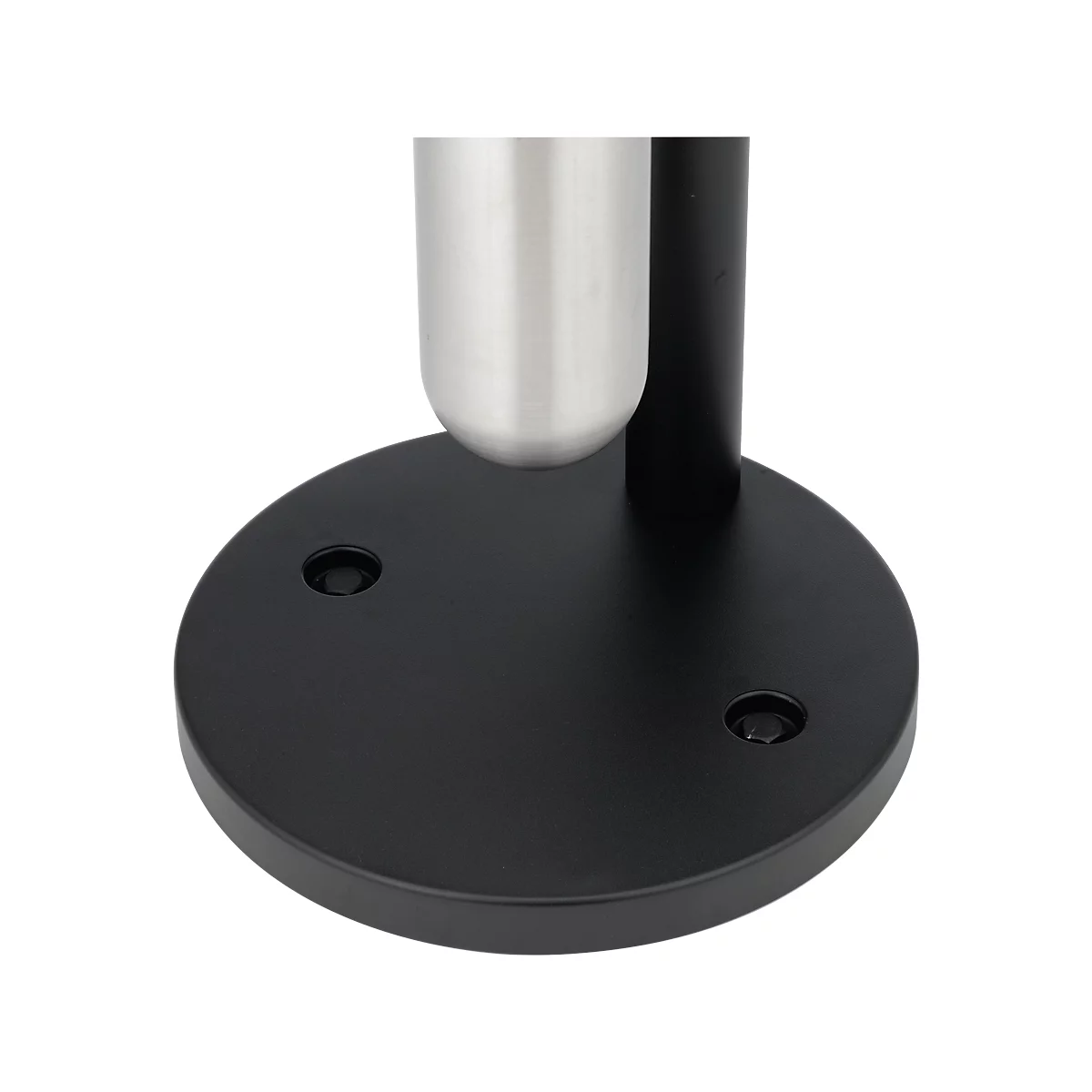 Nahe Ansicht einer schwarzen, runden Basis mit Schrauben und einem silbrig glänzenden Metallteil.