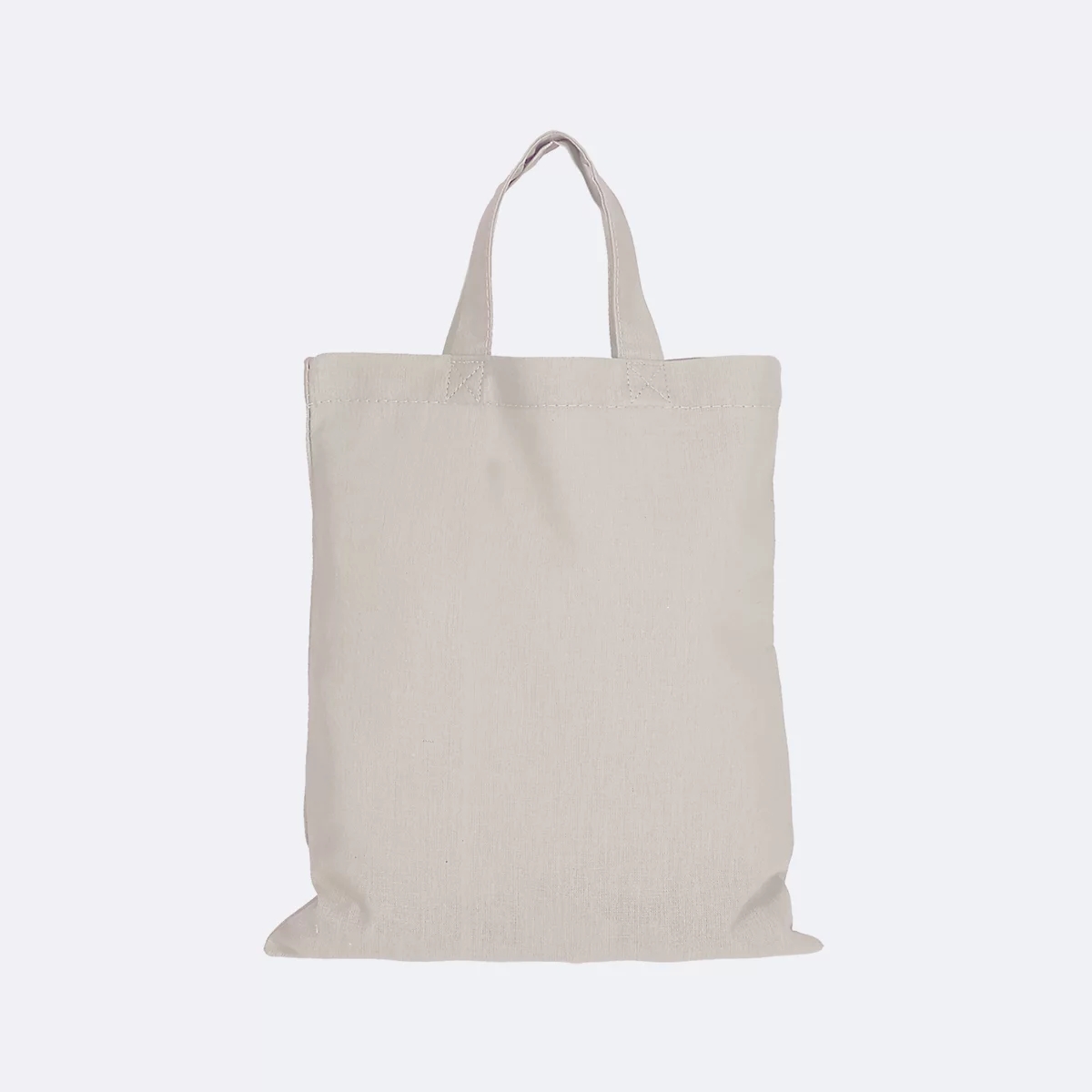 Sac fourre-tout beige sur fond neutre.