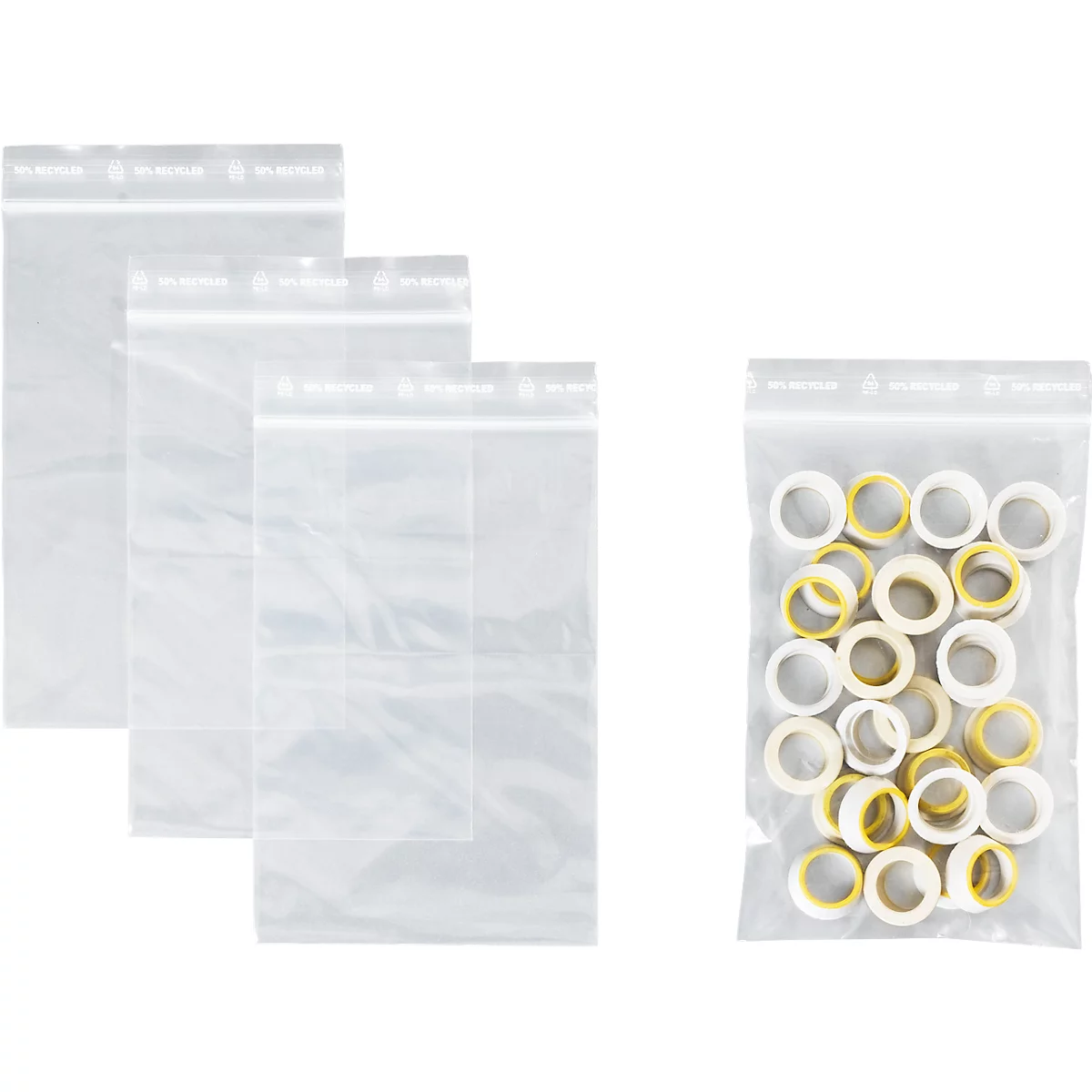 Trois sacs en plastique transparents vides et un sac contenant des joints toriques blancs et jaunes.