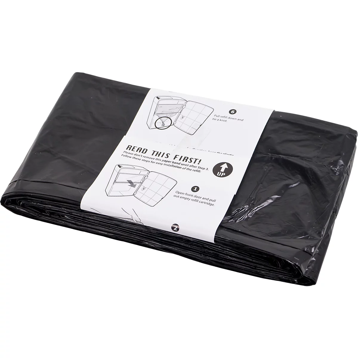 Sacs poubelles noirs roulés. Les instructions sont sur une bande de papier blanche. Flèche vers le haut.