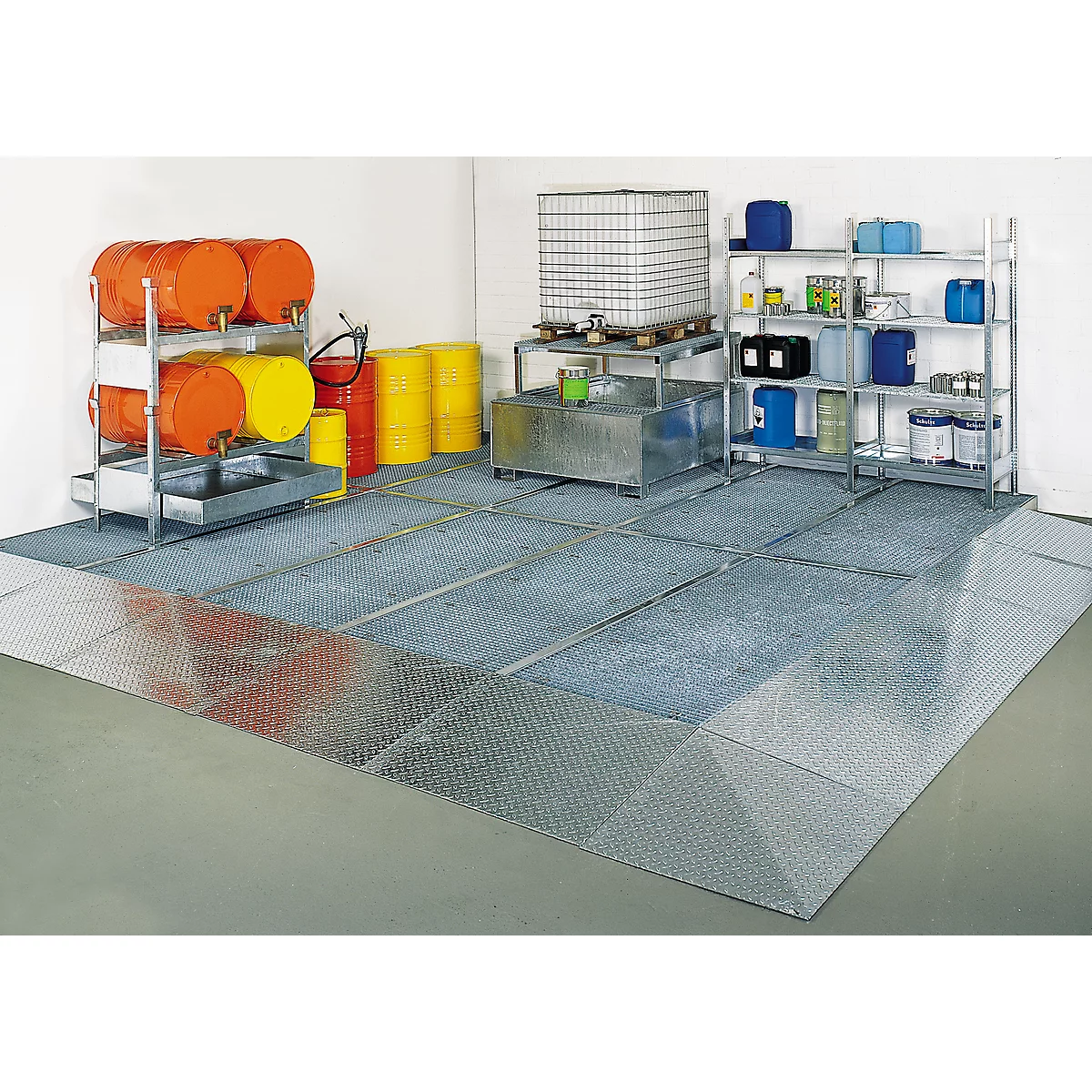 Warehouse with barrels, canisters, and shelves. Metal grid floor absorbing liquids. Protection against liquids.