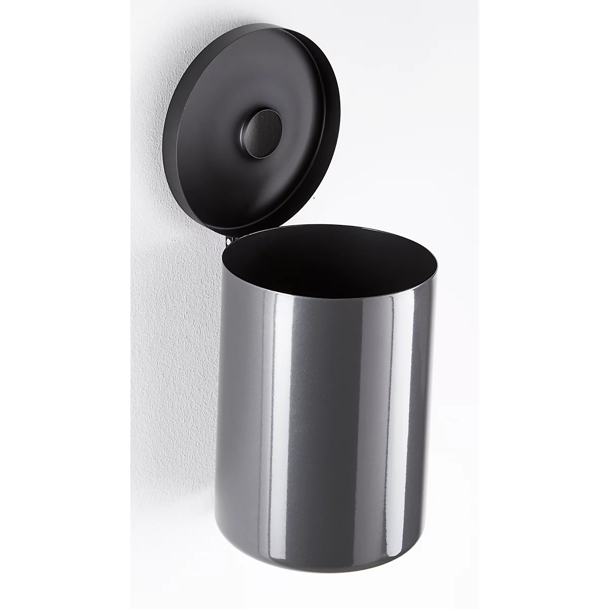 Grey wall-mounted trash can with an open lid. The cylindrical container is fixed to the wall.