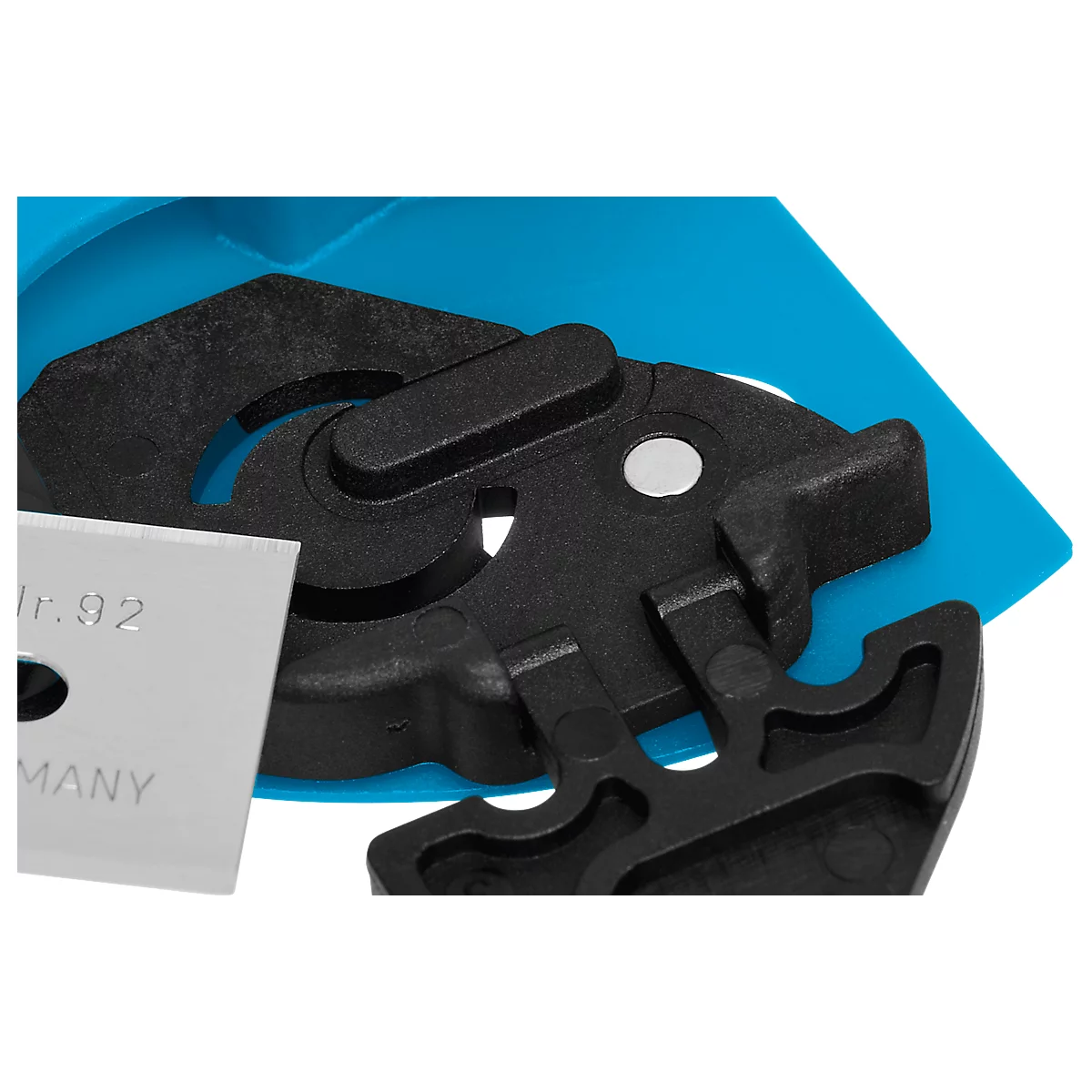 Close-up of black plastic parts with a silver blade. "Nr.92" and "GERMANY" are written on the blade.