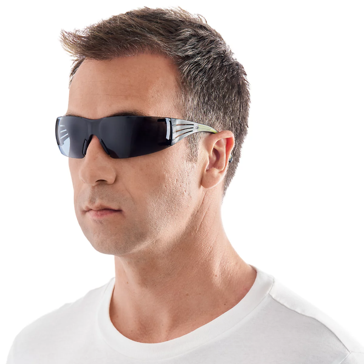 Man wearing sunglasses, in profile against a white background.