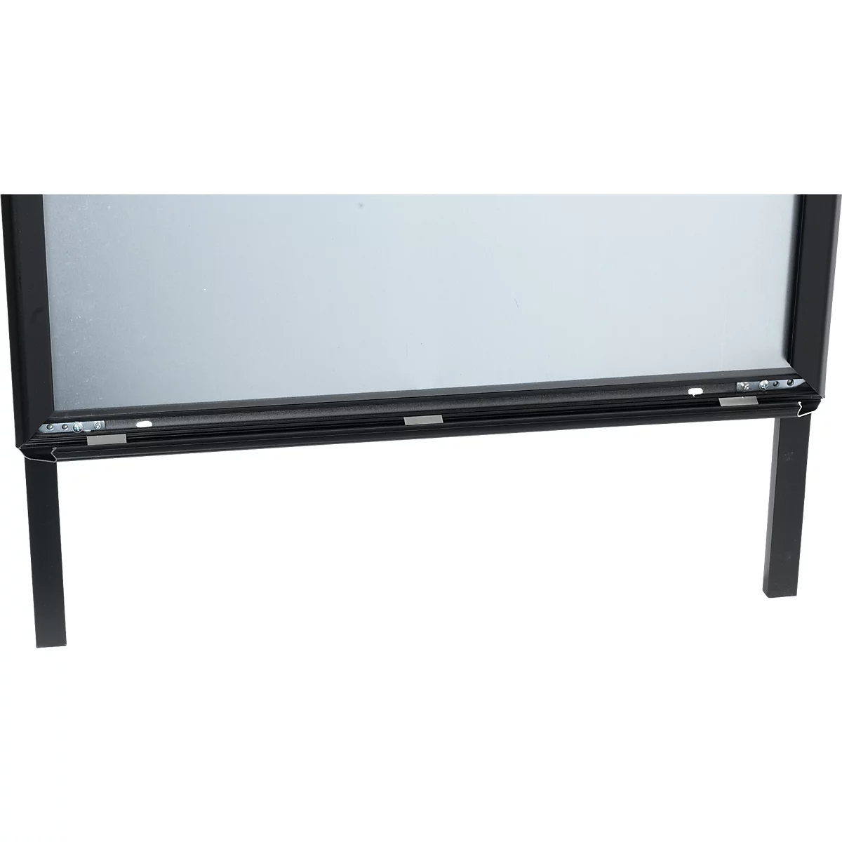 Black advertising board with silver surface, rectangular and with two legs.