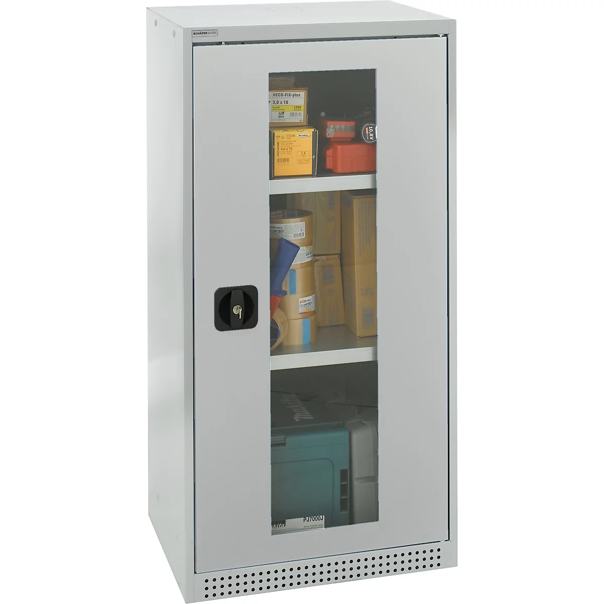 Grey steel cabinet with glass window and black handle. Shelves with various items, including boxes and equipment.