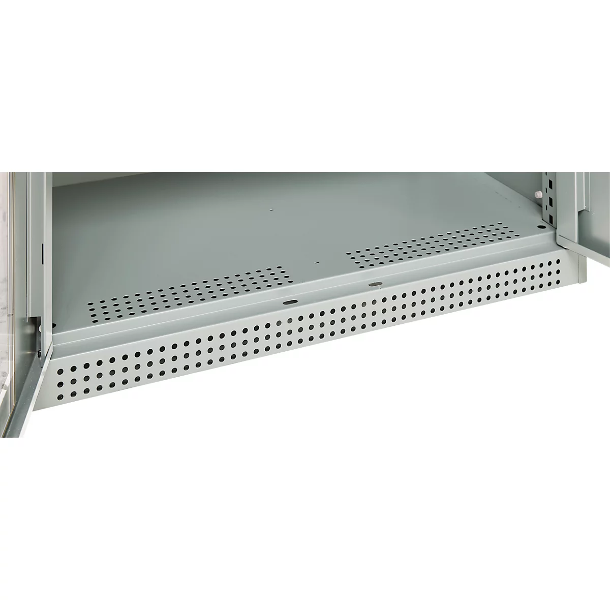 Detailed view of a grey metal cabinet. The lower shelf is perforated with small holes.