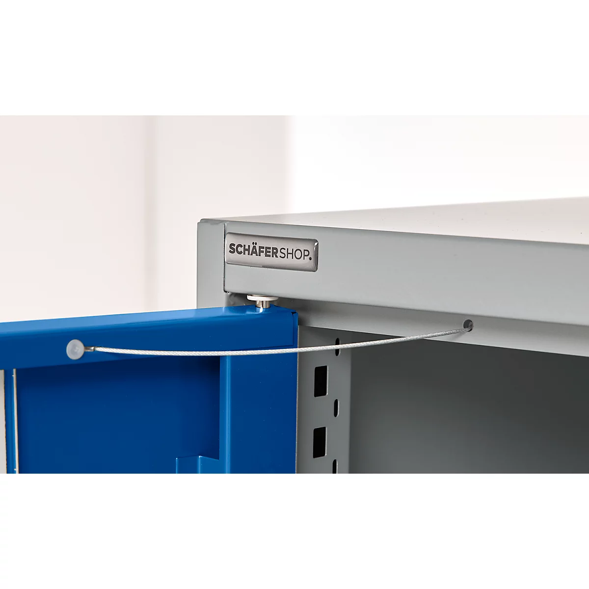 Steel shelf with partially open blue door, wire holding the door open, Schäfershop logo.