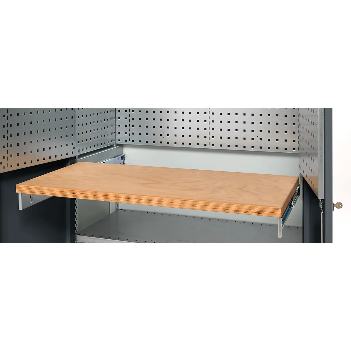 An open gray cabinet interior featuring a brown wooden shelf pulled out on metal tracks. There are holes on the back wall.