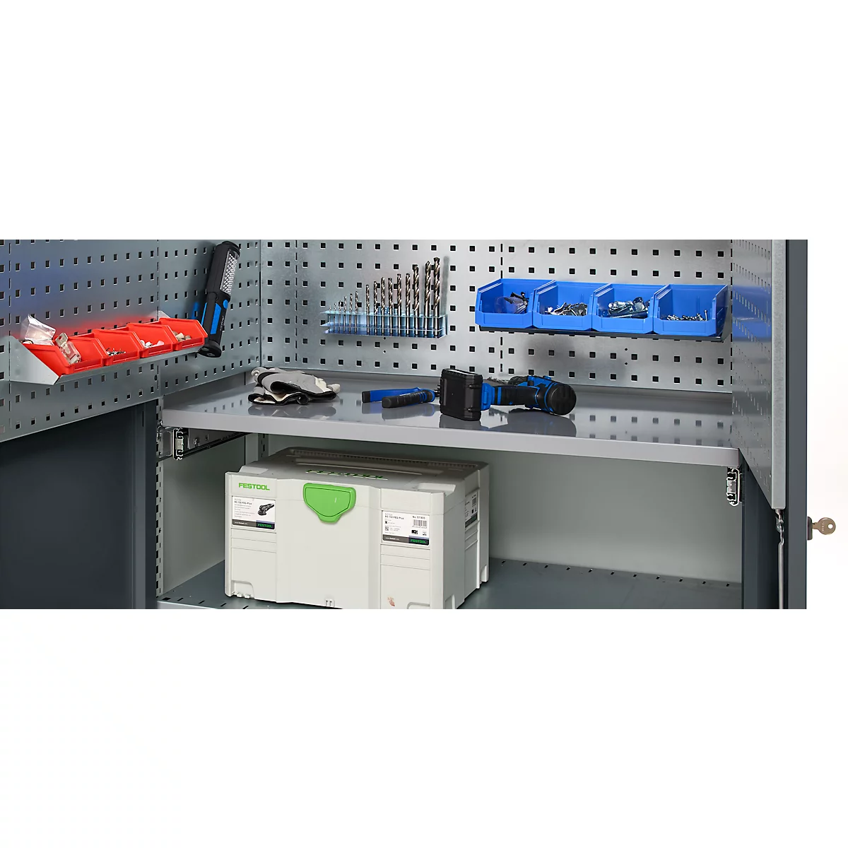 Tool cabinet with tools, including drill bits, screws, and a drill. The tools are neatly stored.