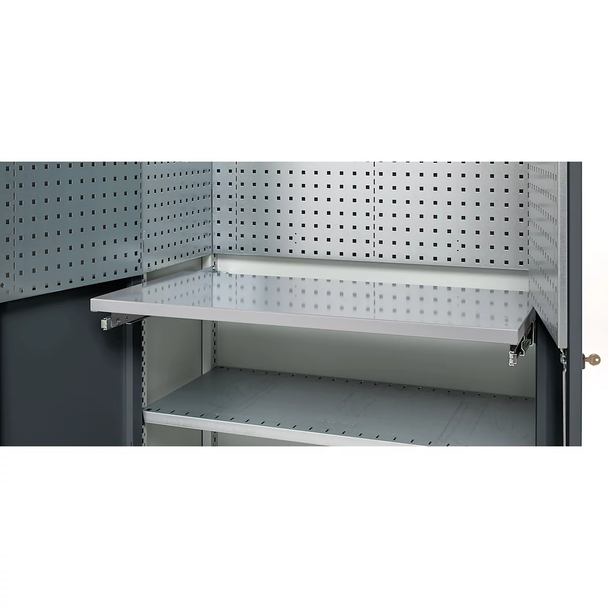 Close-up of an open gray tool cabinet with shelves and perforated walls.