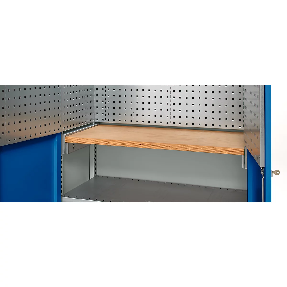 Interior of a blue tool cabinet, featuring perforated metal walls, wooden shelf, and shelves.