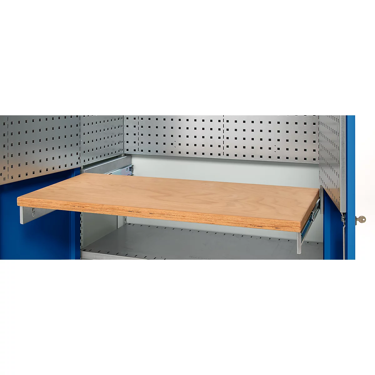 Close-up of a workshop cabinet with an extended wooden shelf. The cabinet is blue and silver. The shelf is supported by silver brackets.