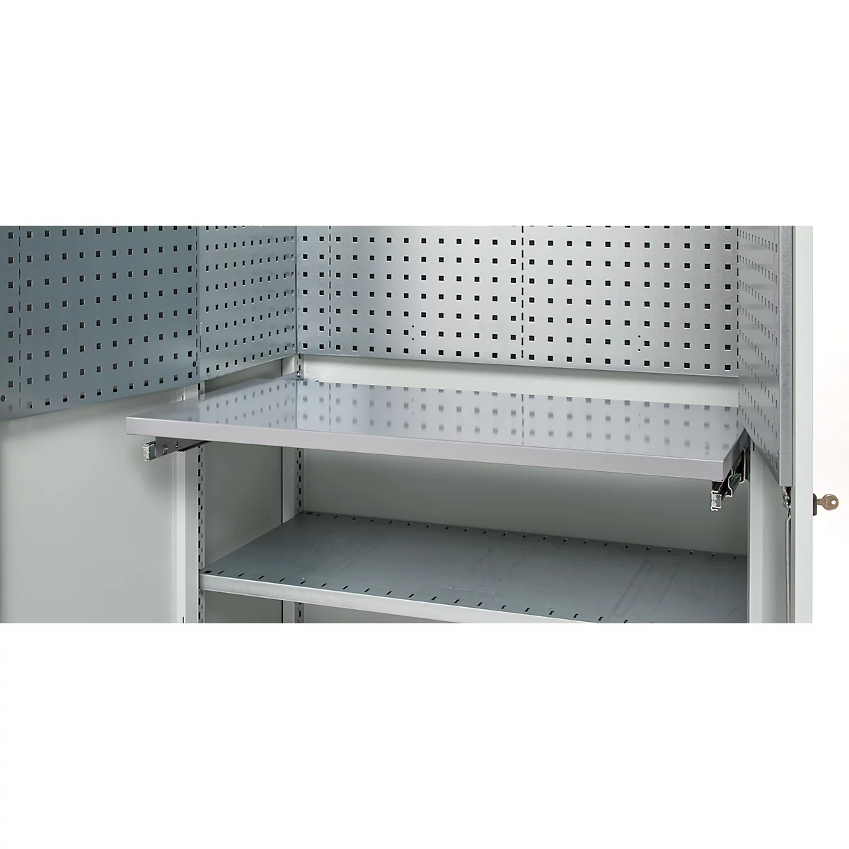 Open cabinet with perforated walls and shelves, metallic color. The upper shelf is pulled out.