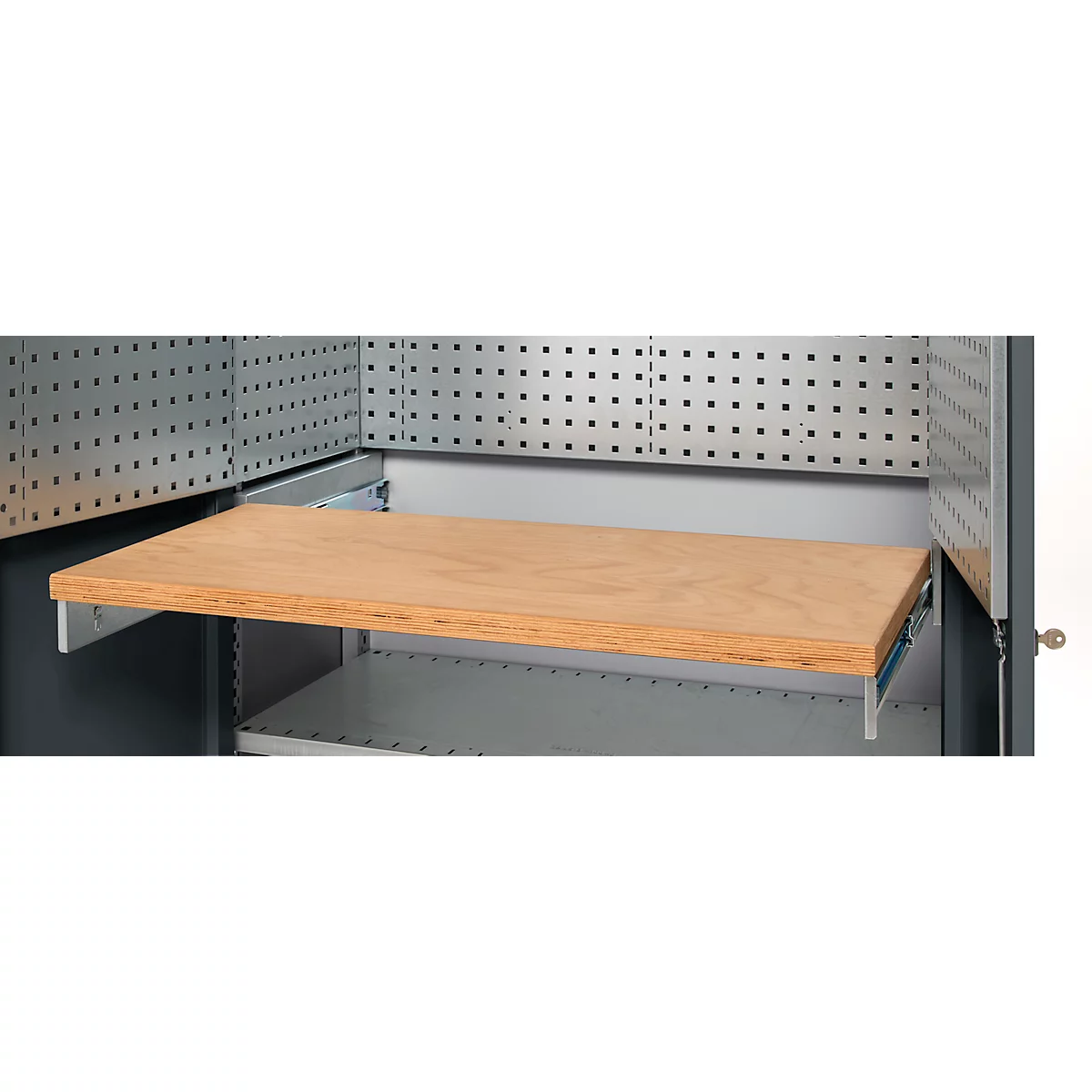 Detail of a cabinet with a wooden shelf that can be pulled out on metallic rails. Above, a perforated plate.