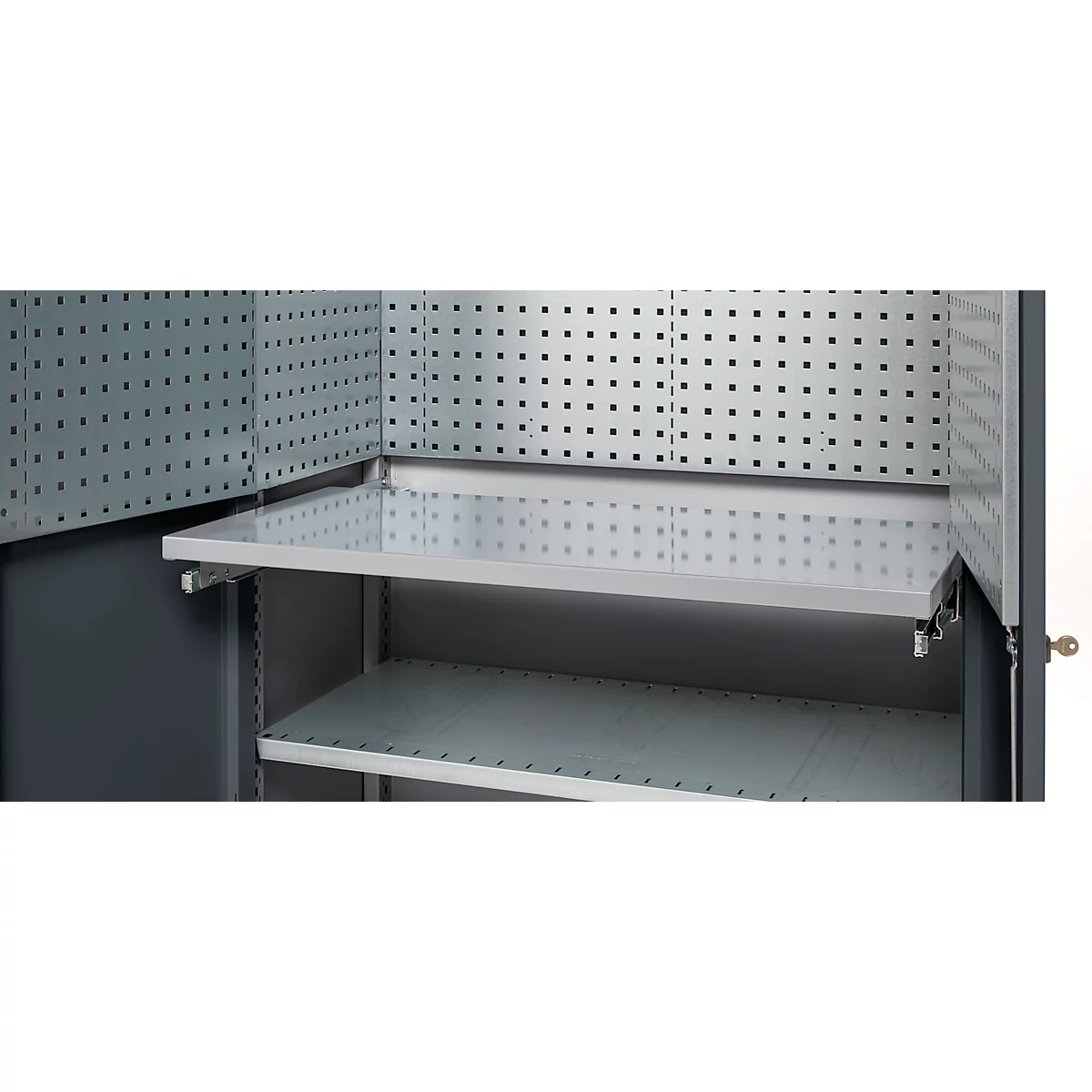 Grey tool cabinet from the inside with shelves and perforated walls.
