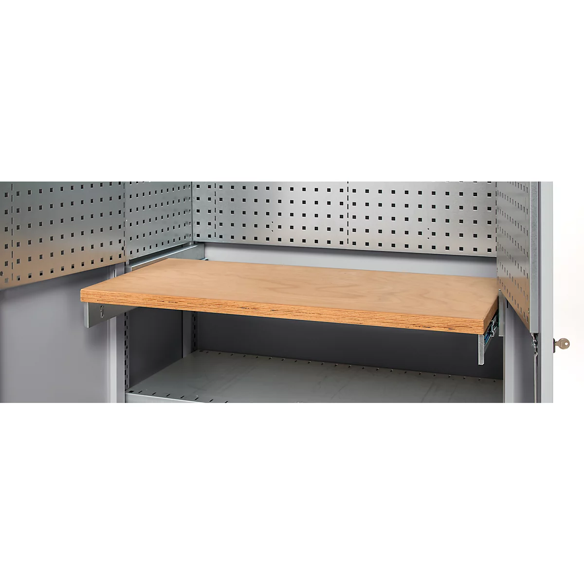 Inside a tool cabinet with wooden shelf. Grey metal frame with hole walls.