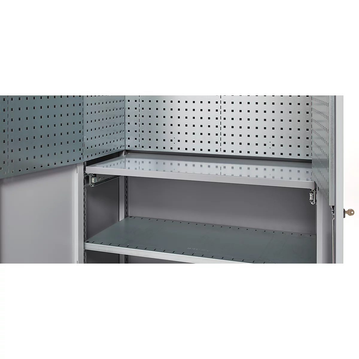 Open metal cabinet, interior with holes and two shelves.