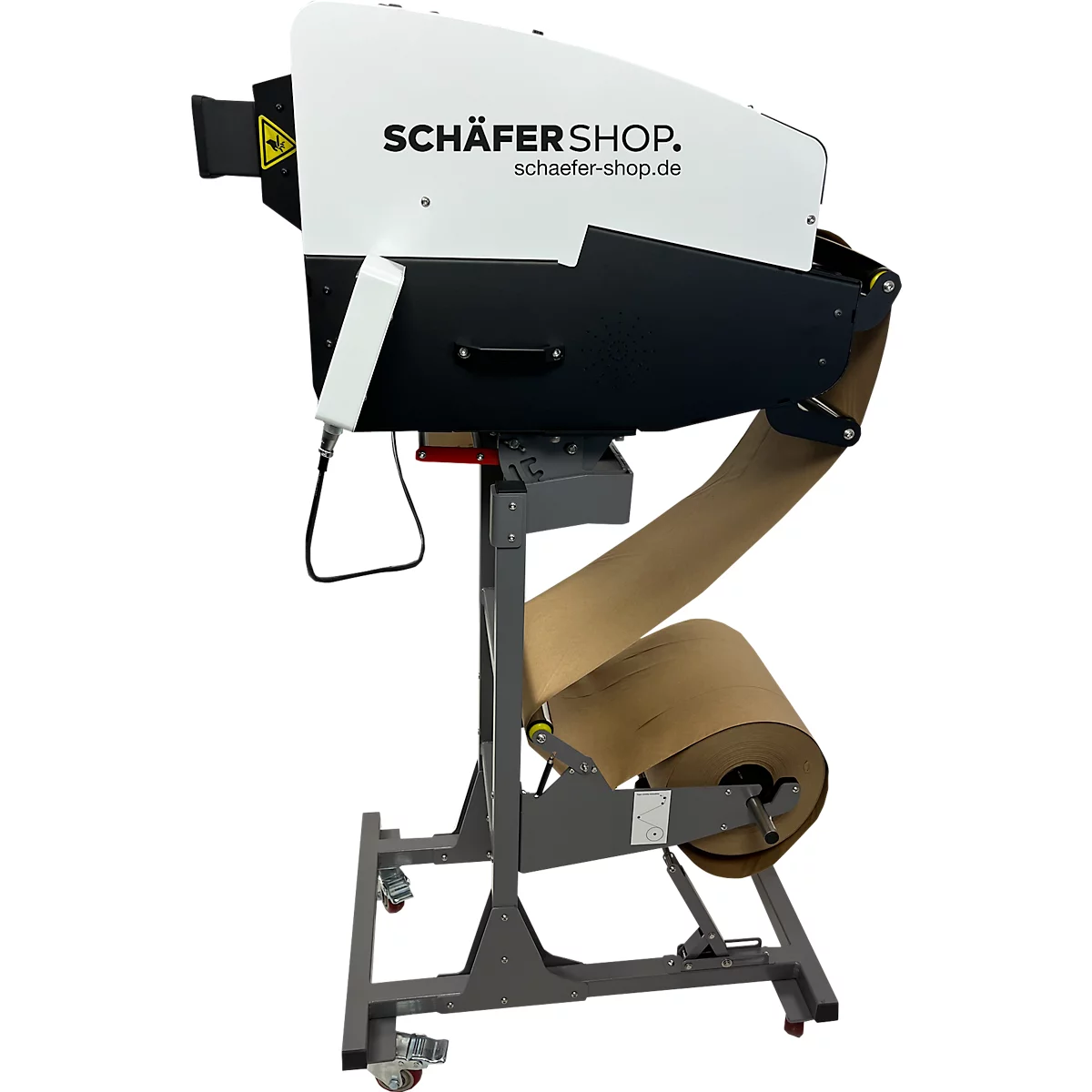 Verpakkingsmachine met papieren rol. Op de behuizing staat 'SCHÄFER SHOP'.
