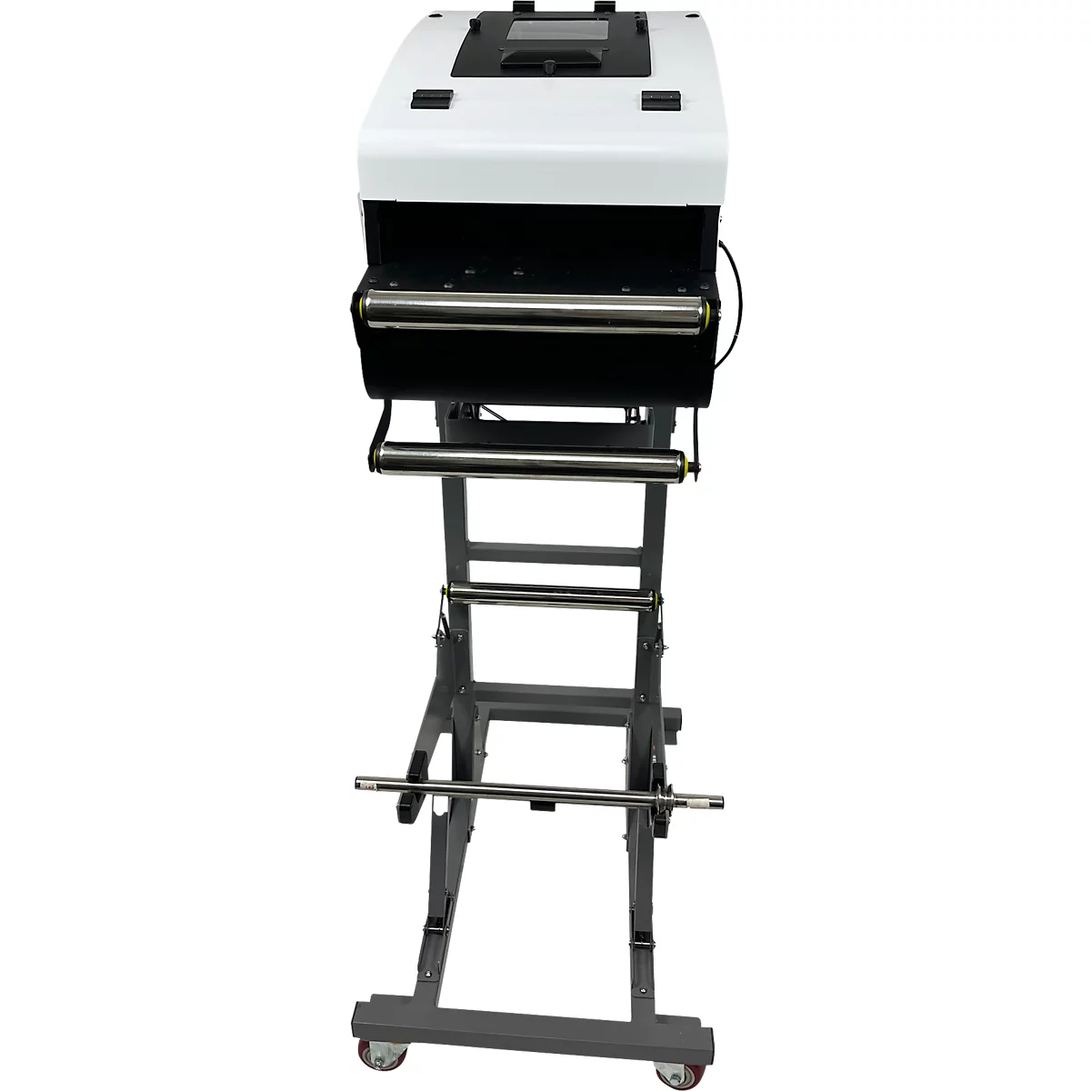 Industrielle Folienschweissmaschine. Weiss-schwarzes Gerät auf grauem Gestell mit Rollen.