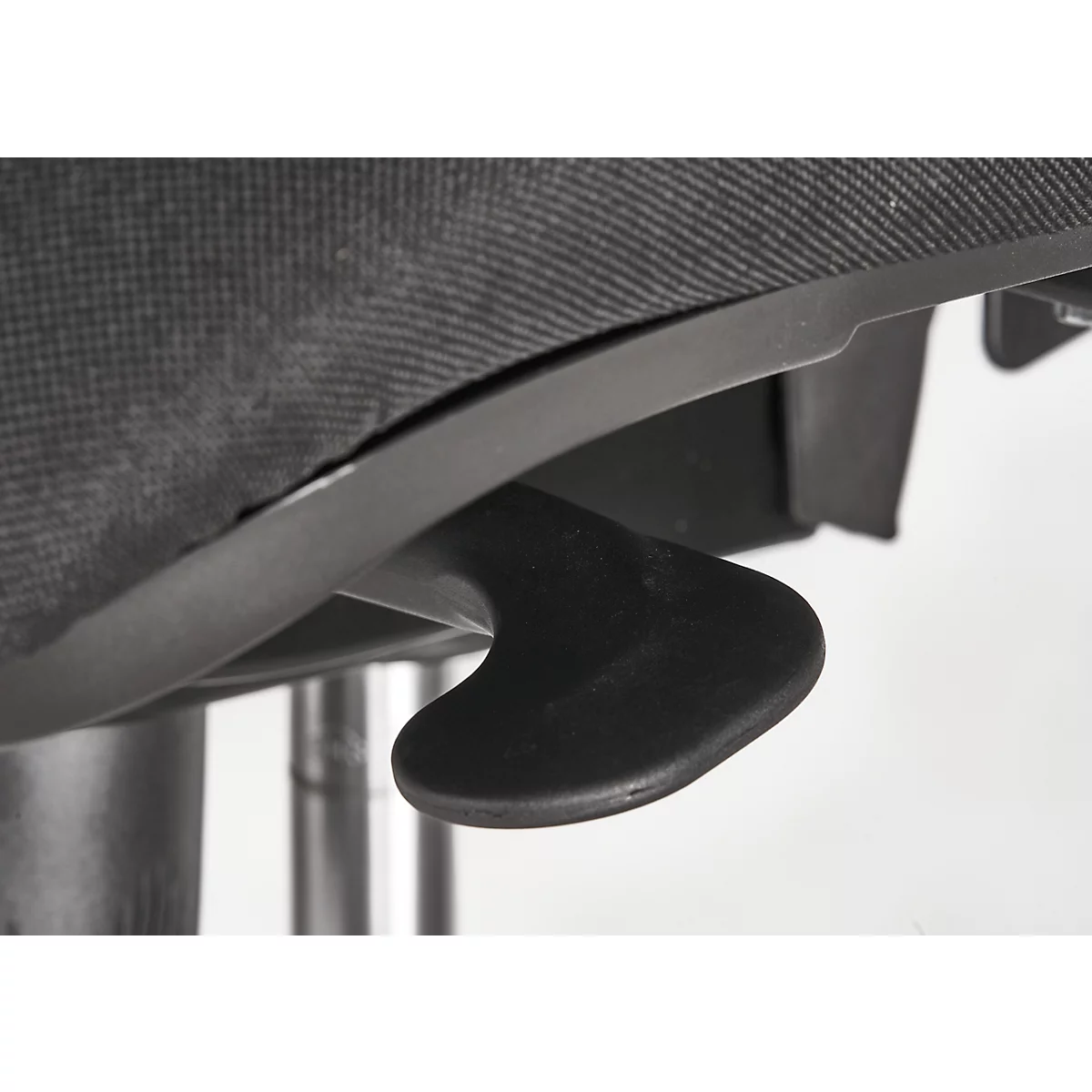 Close-up of a black lever under a black chair, the fabric is gray. The background is white.