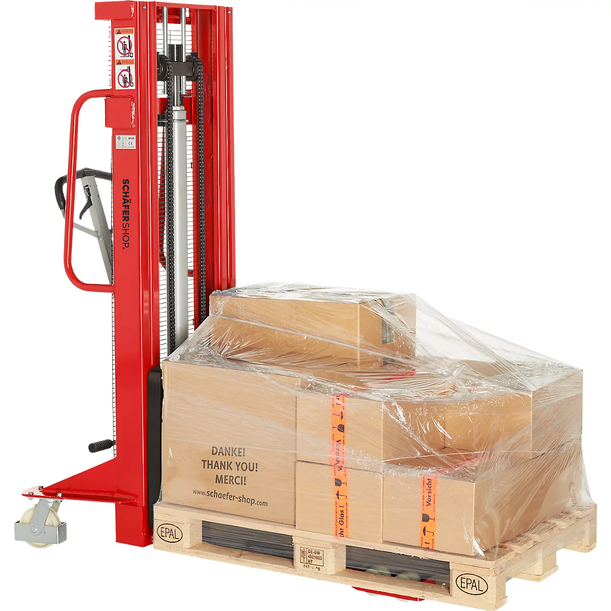 Red forklift lifting a pallet of boxes wrapped in plastic wrap. "DANKE! THANK YOU! MERCI!" is printed on a box.