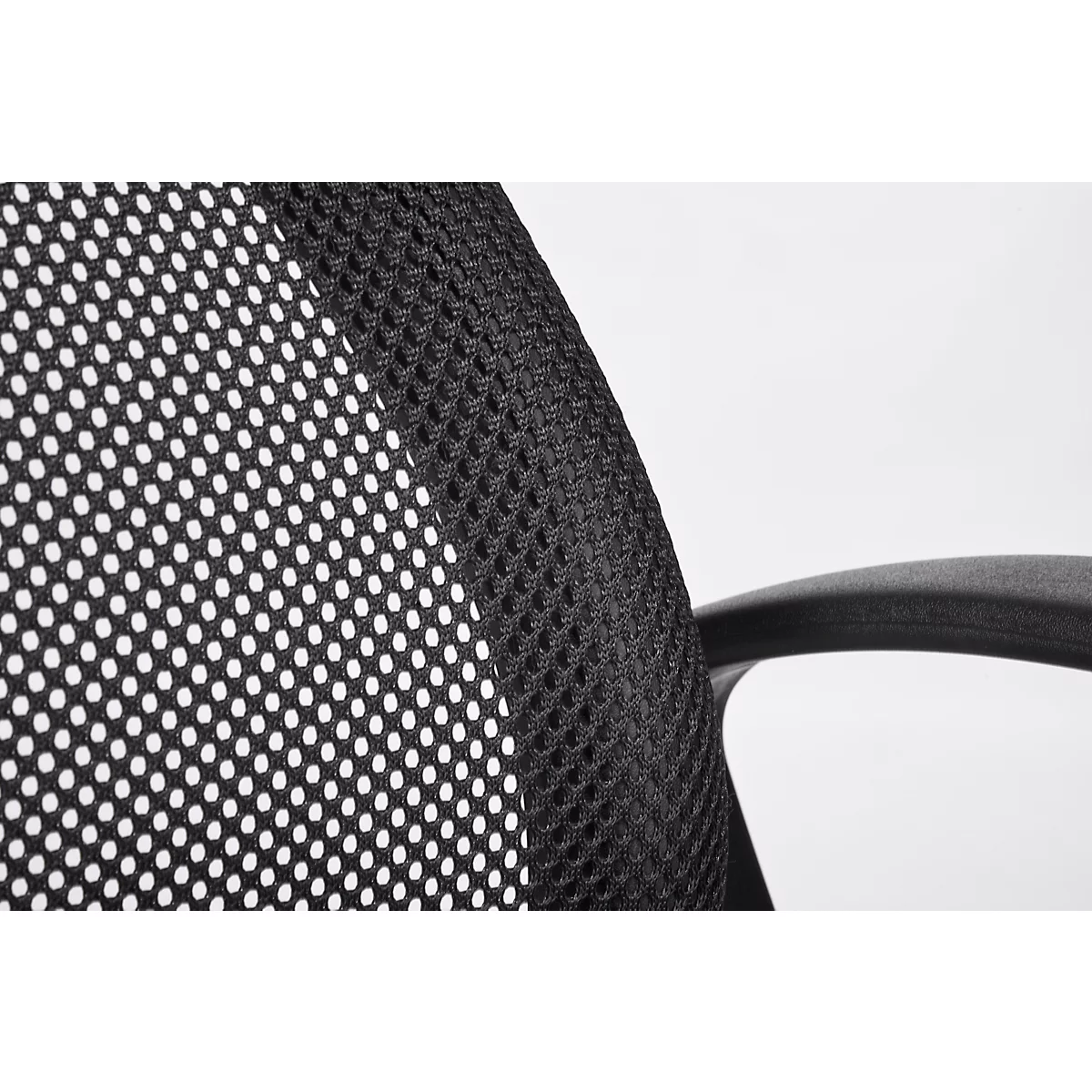 Detail of a black office chair: Mesh fabric with holes and an armrest on a light background.