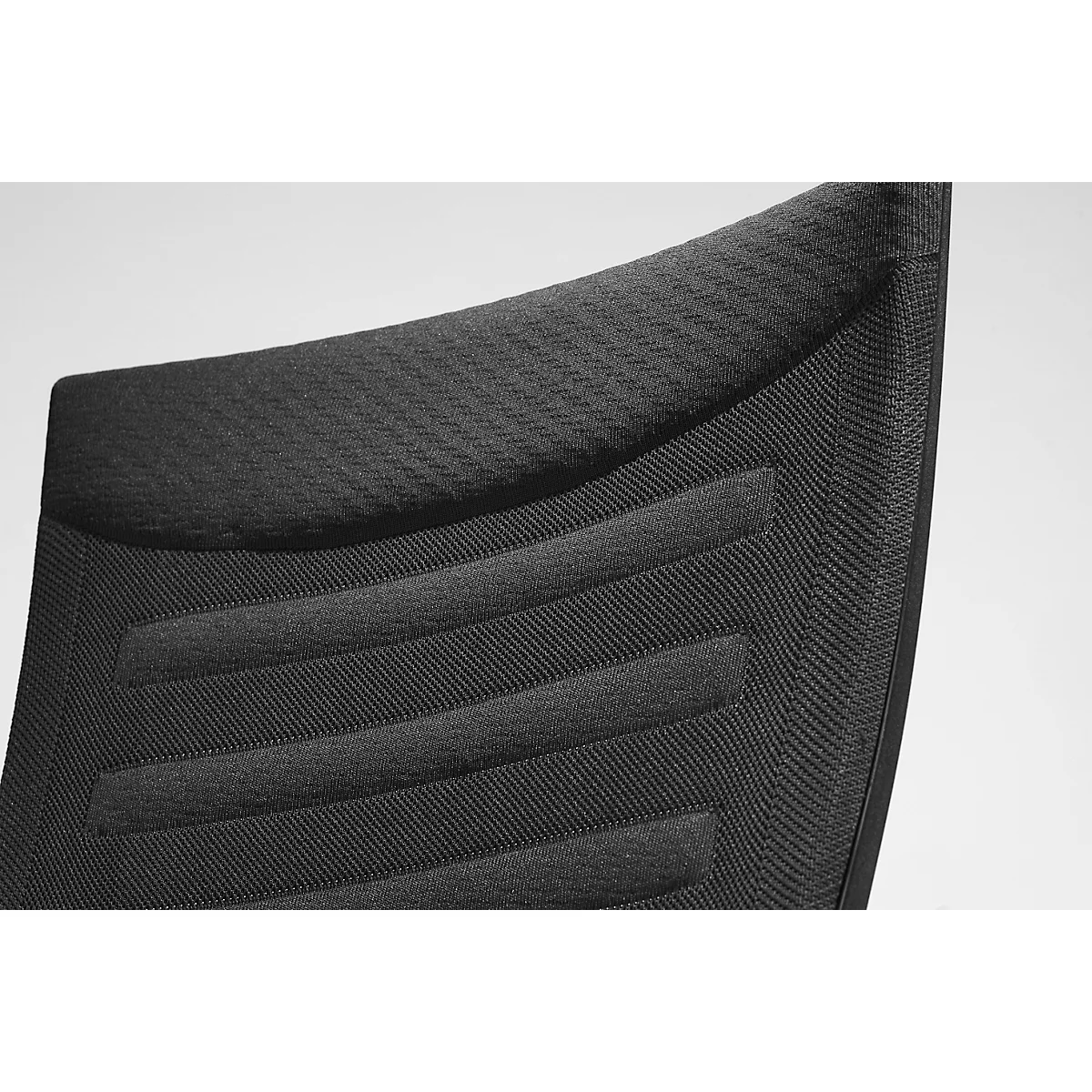Close-up of the black chair back with horizontal padded stripes and diagonal texture.