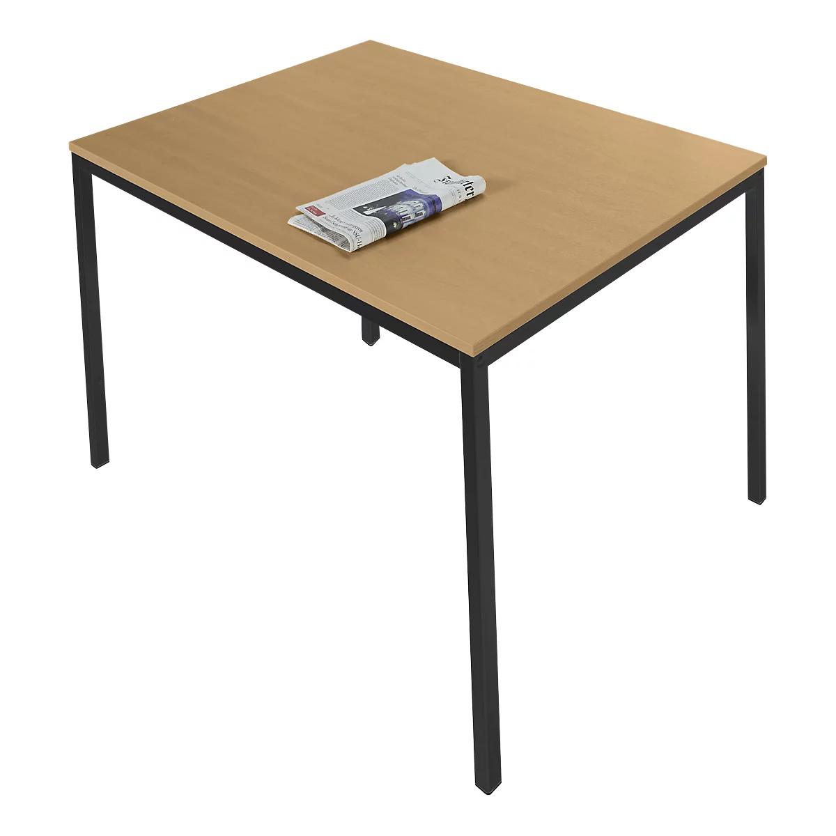 A rectangular table with a light brown tabletop and black legs. A newspaper rests on the table.