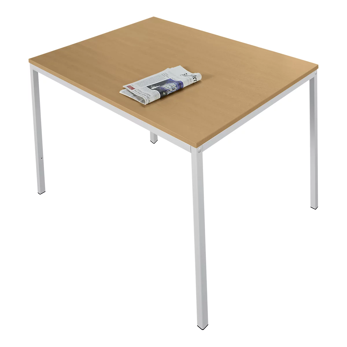 A light wooden table with white legs, with a newspaper on it.