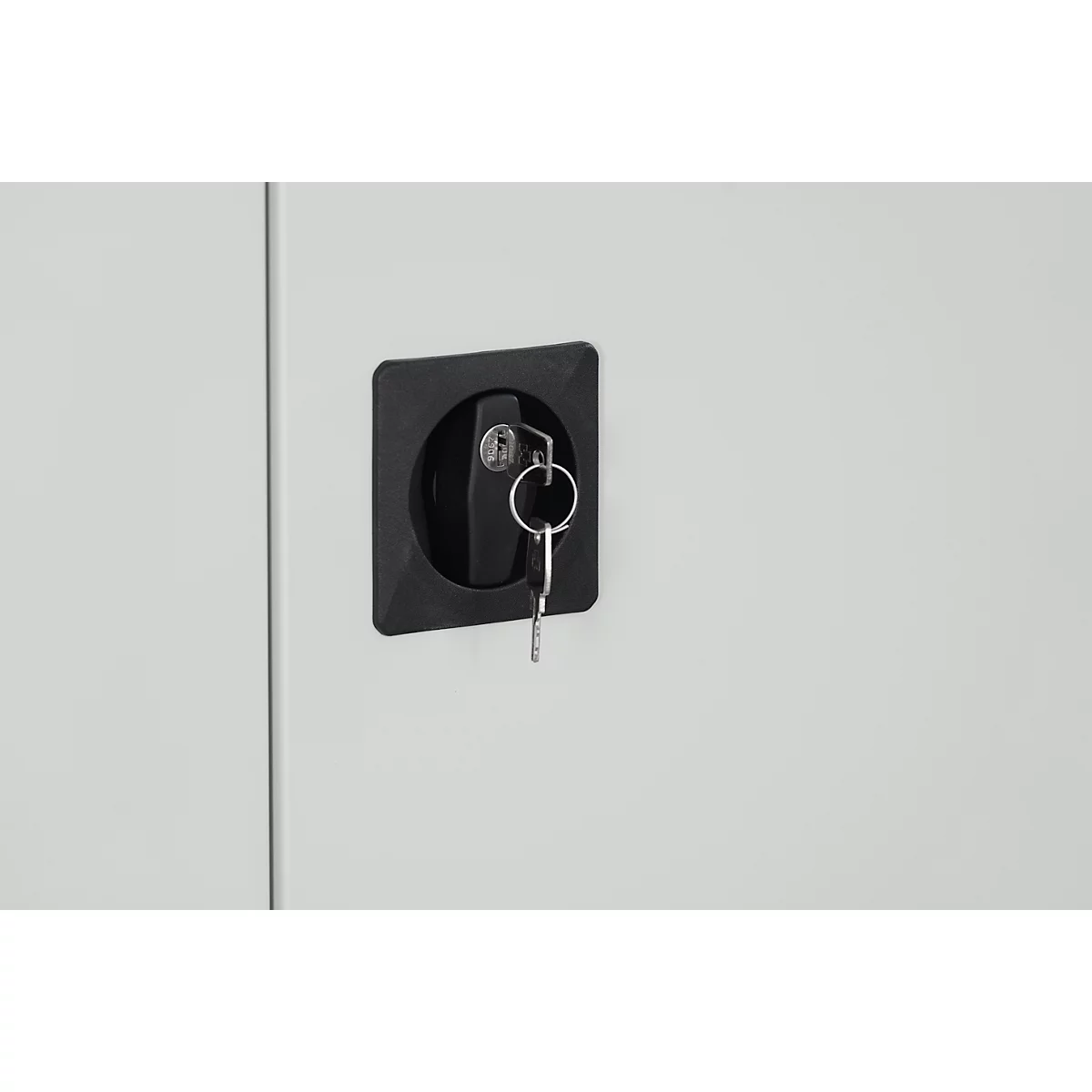 Detail shot: Black lock with keys on a gray door.